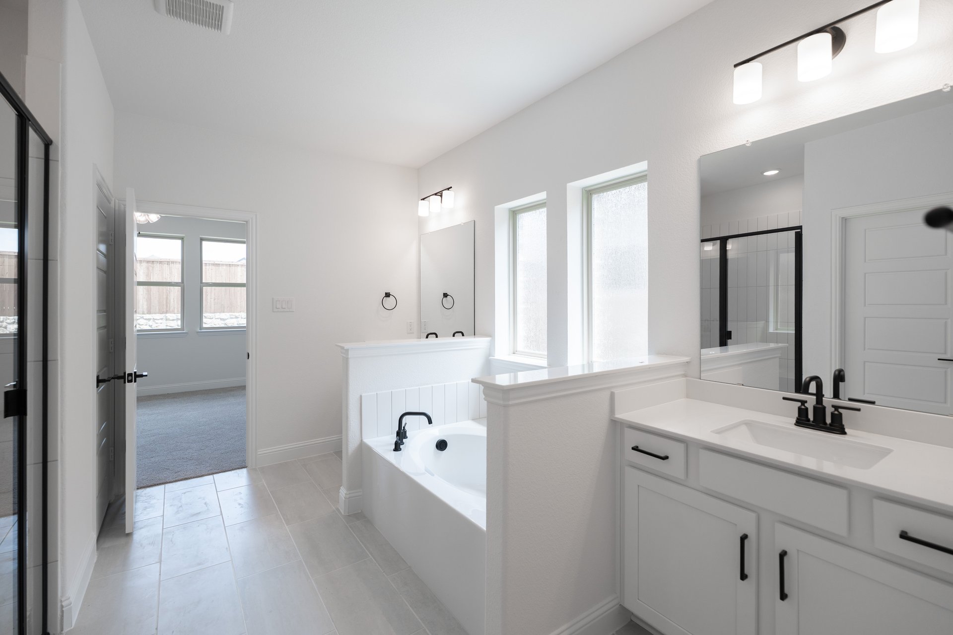 primary bathroom with soaking tub and walk-in shower