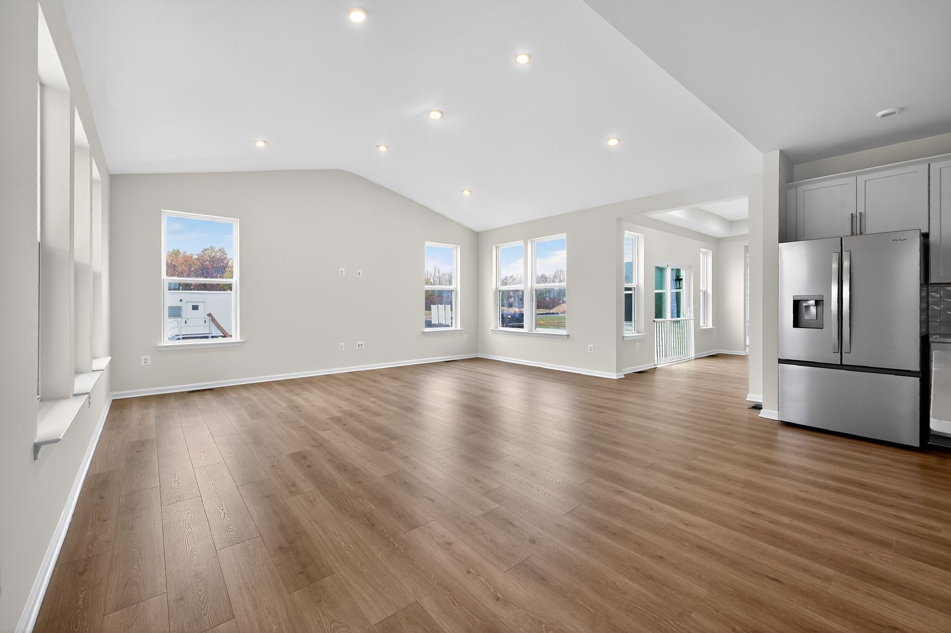 bright open great room with designer flooring