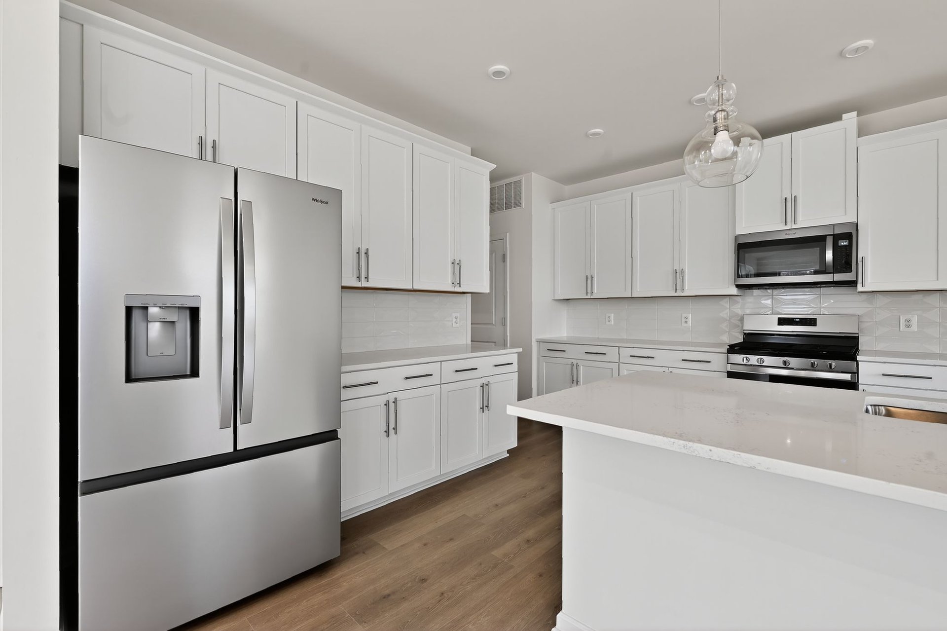 kitchen with white cabinets and countertops
