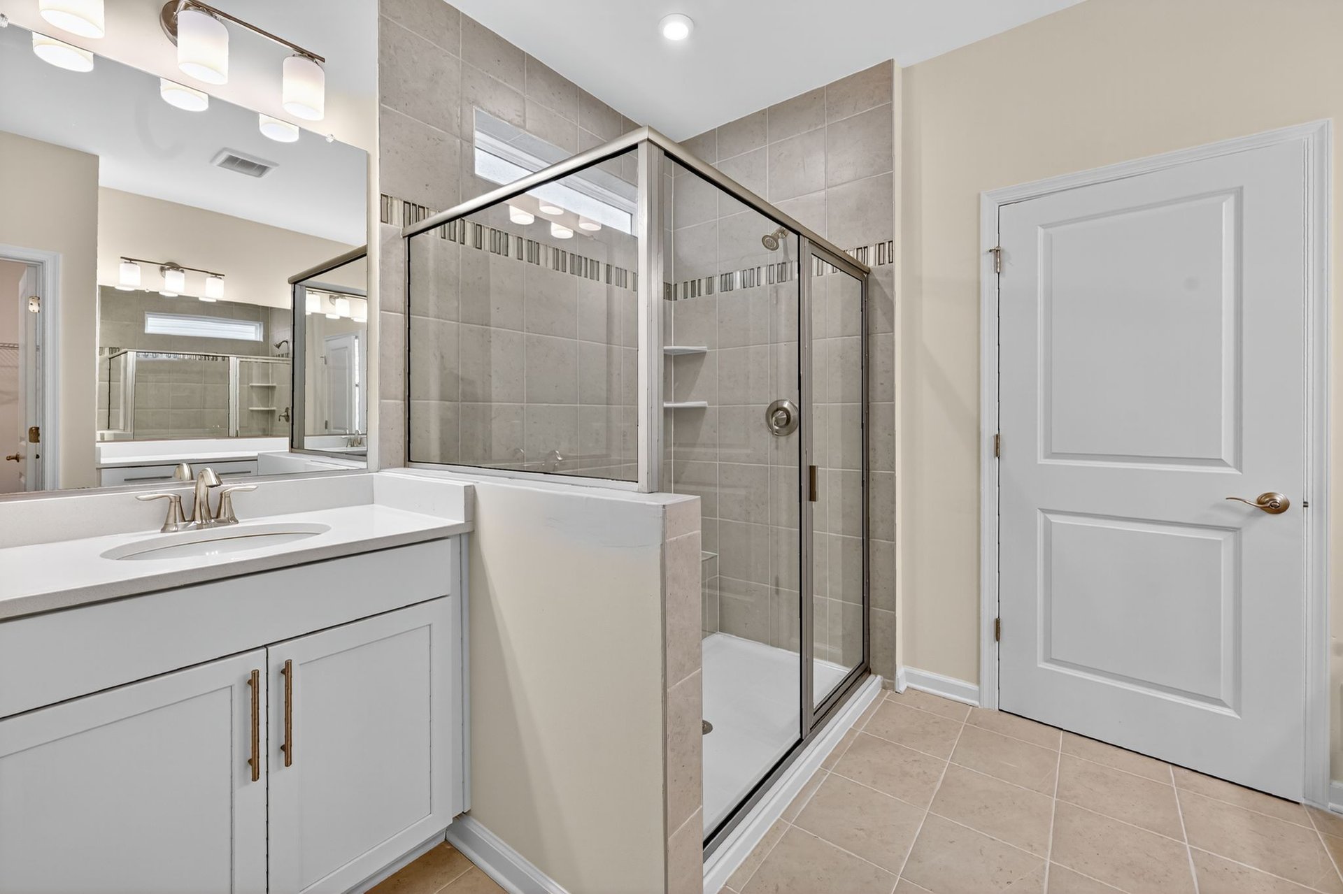 primary bath showcasing the separate shower and soaking tub