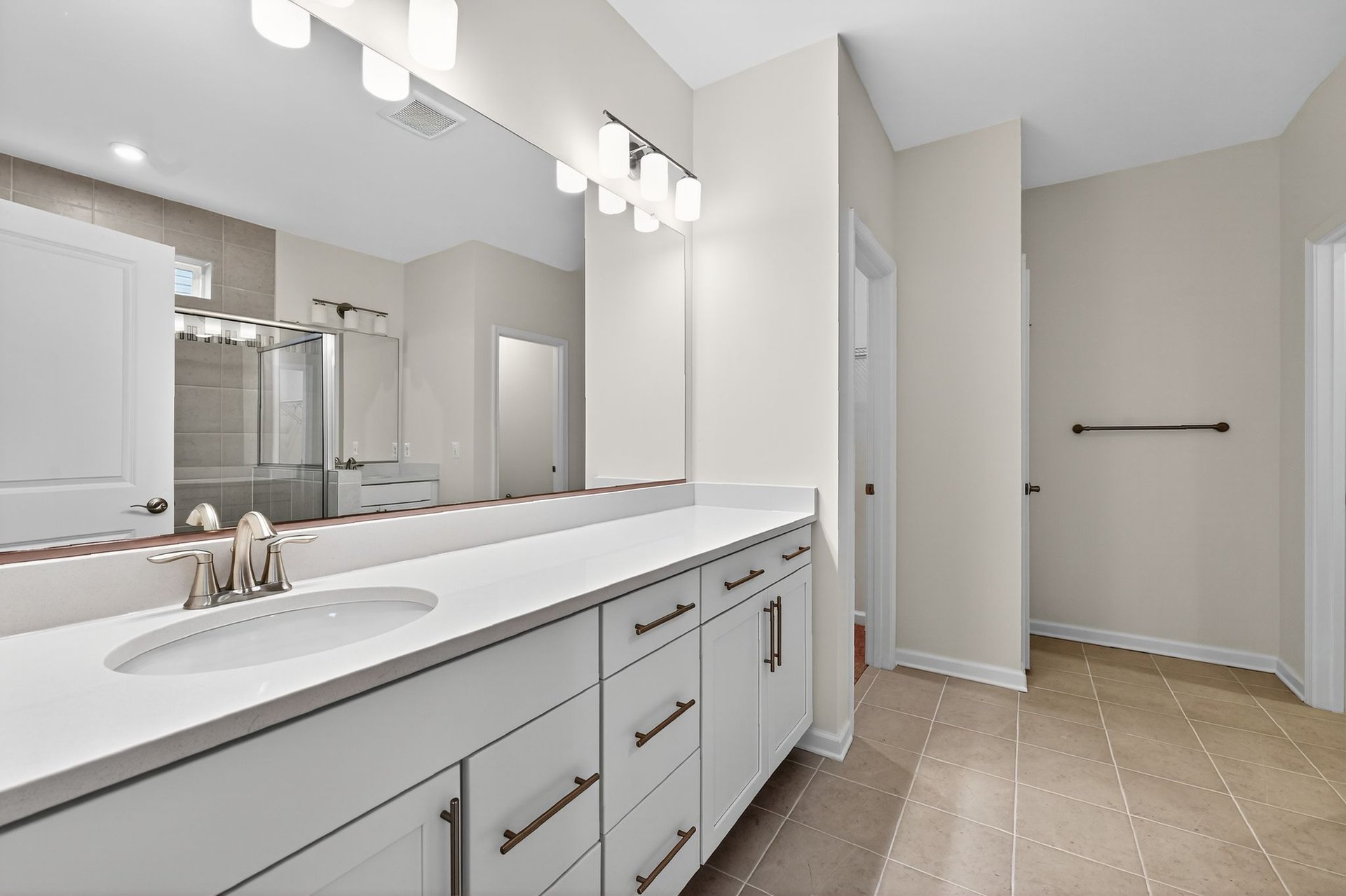 primary bath with comfort height dual vanities