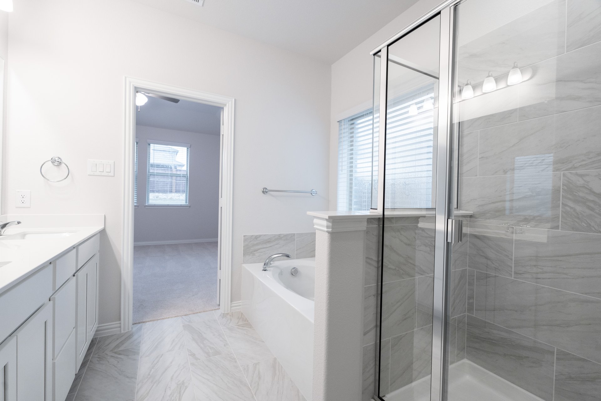 primary bathroom with soaking tub and walk-in shower