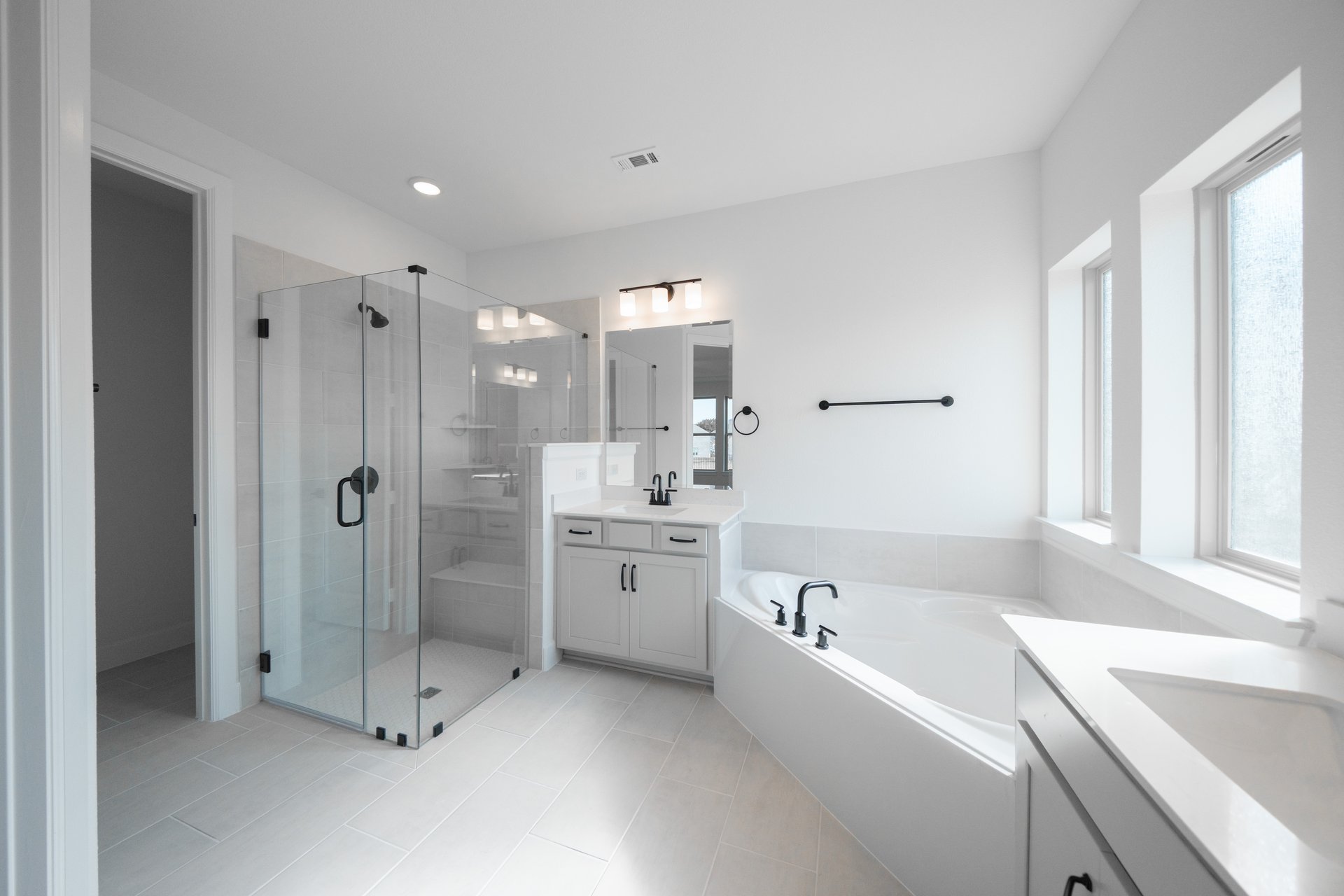 primary bathroom with soaking tub and walk-in shower