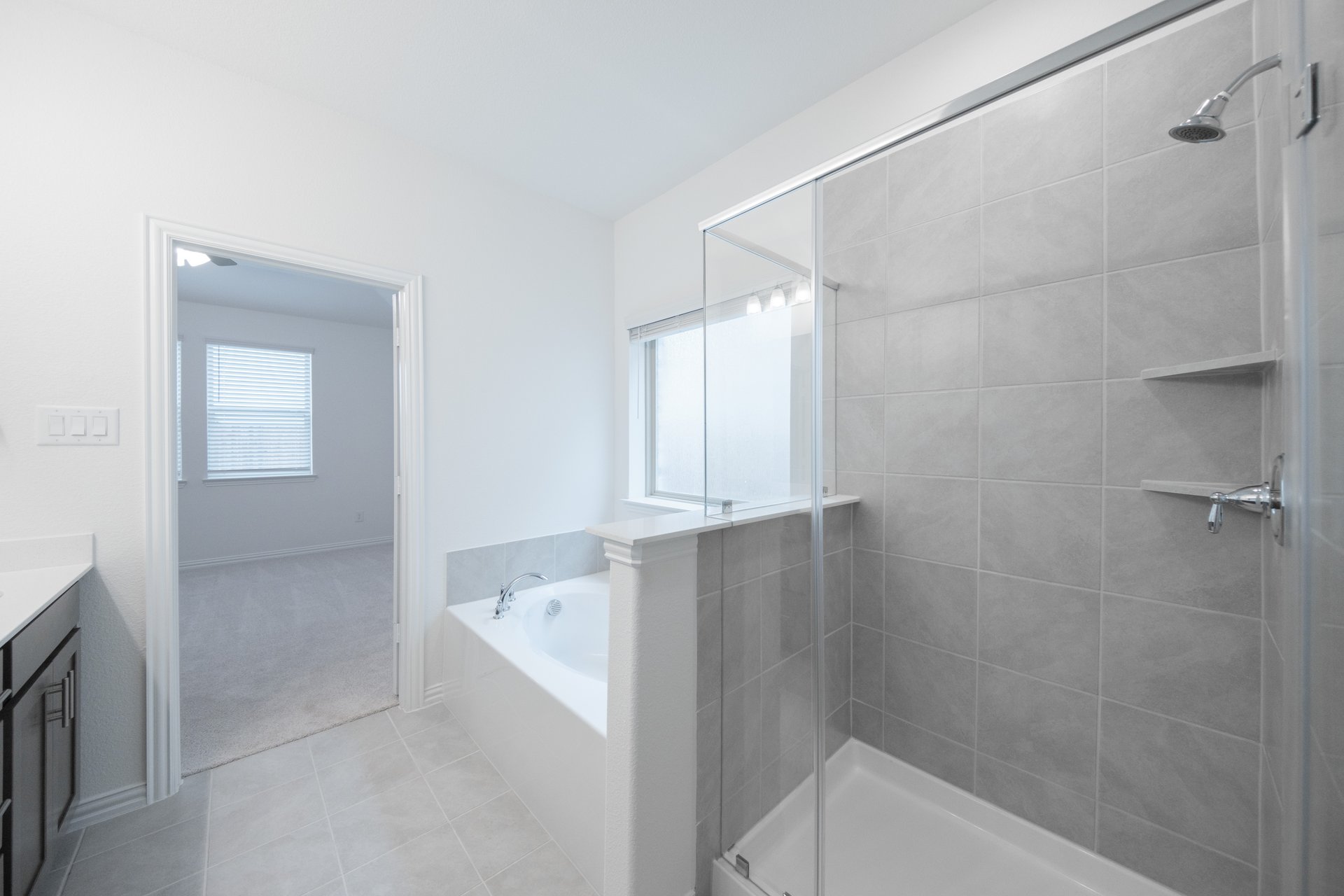 primary bathroom with soaking tub and walk-in shower
