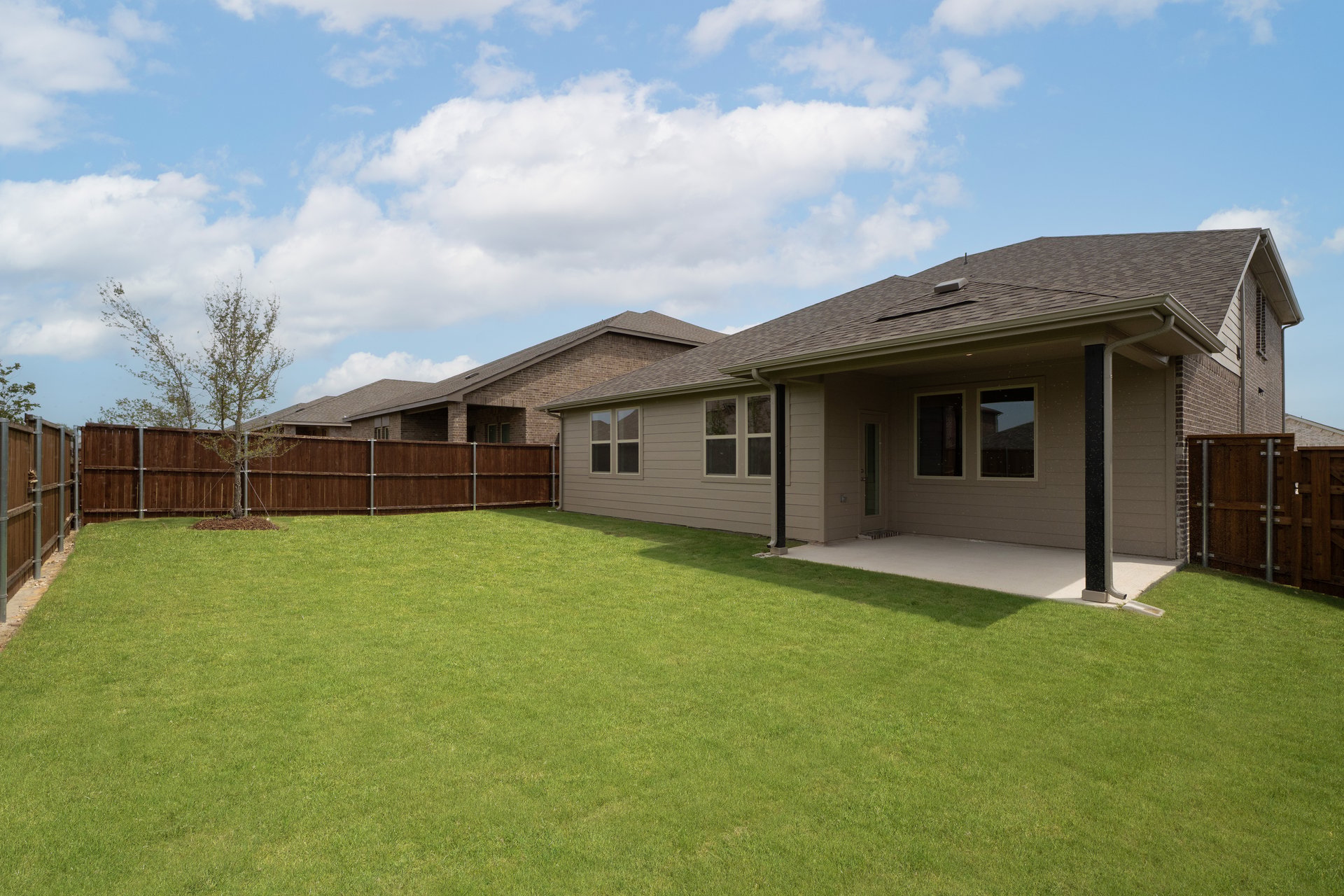 backyard of home with grass