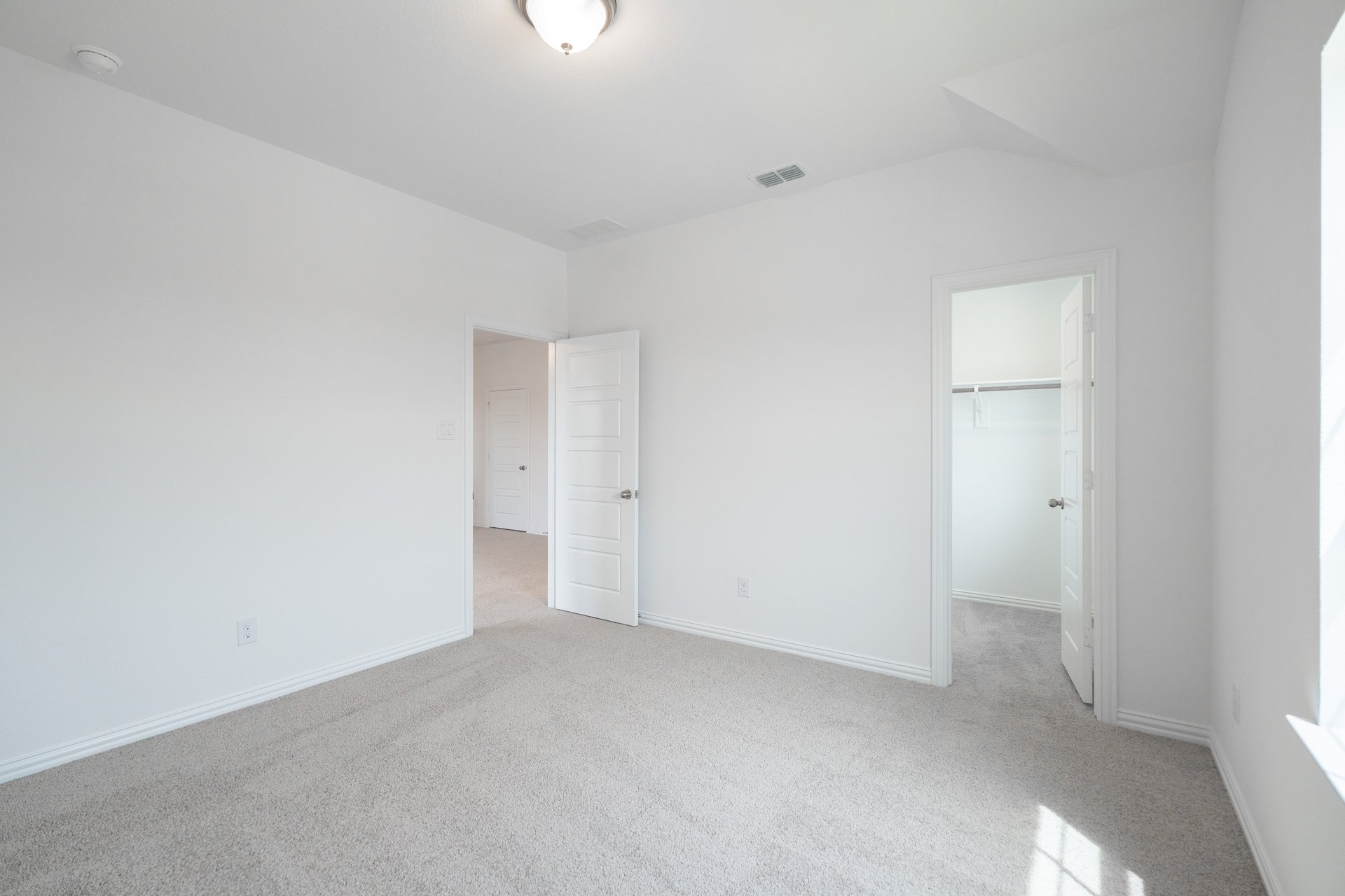 guest bedroom with carpet