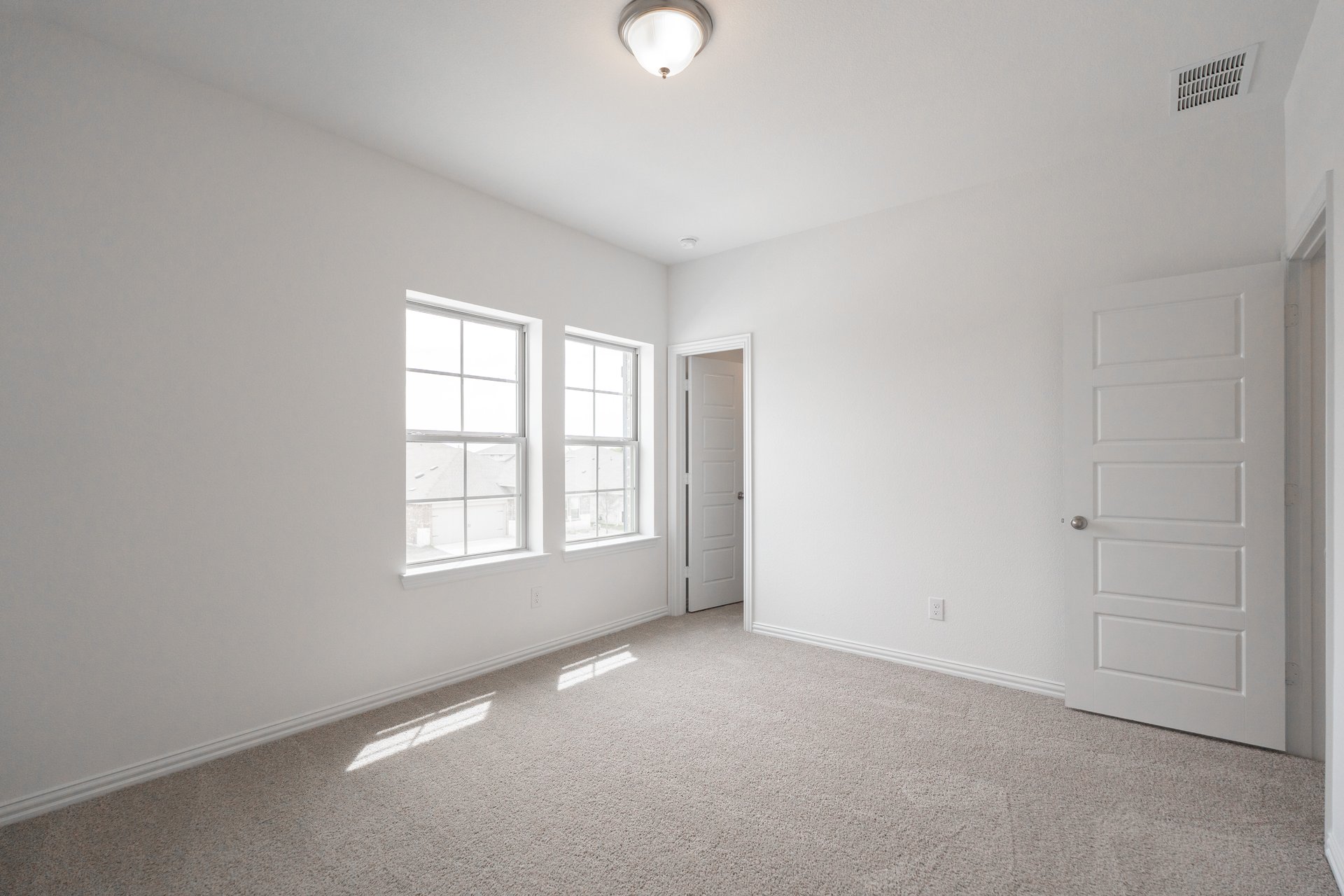 guest bedroom with carpet