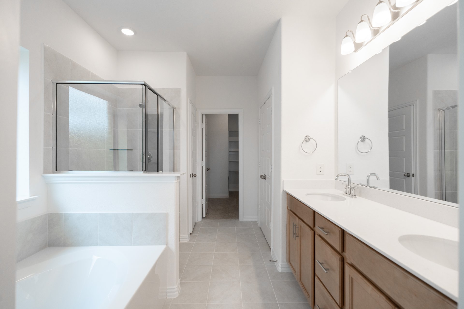 primary bathroom with soaking tub and shower