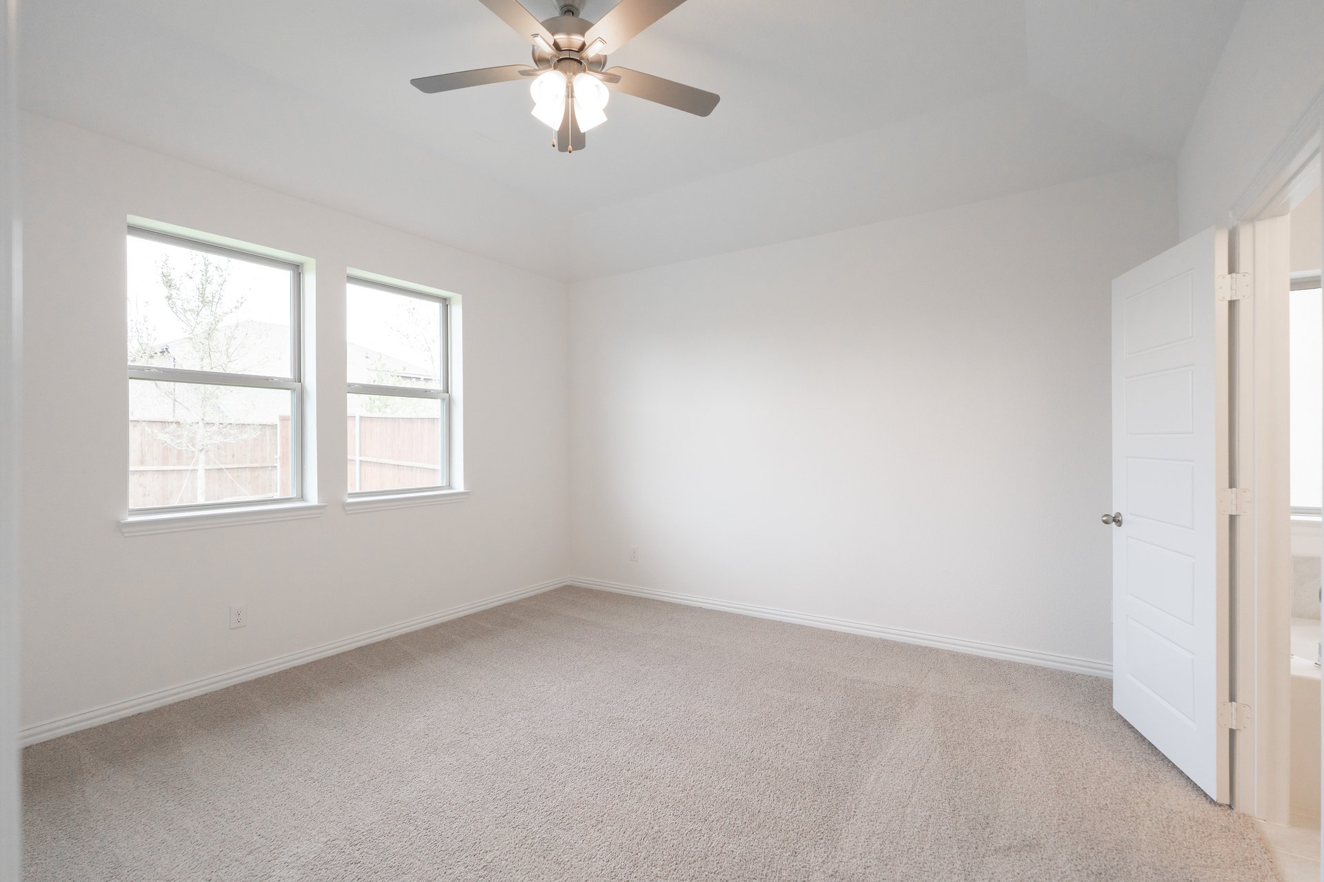 primary bedroom with carpet