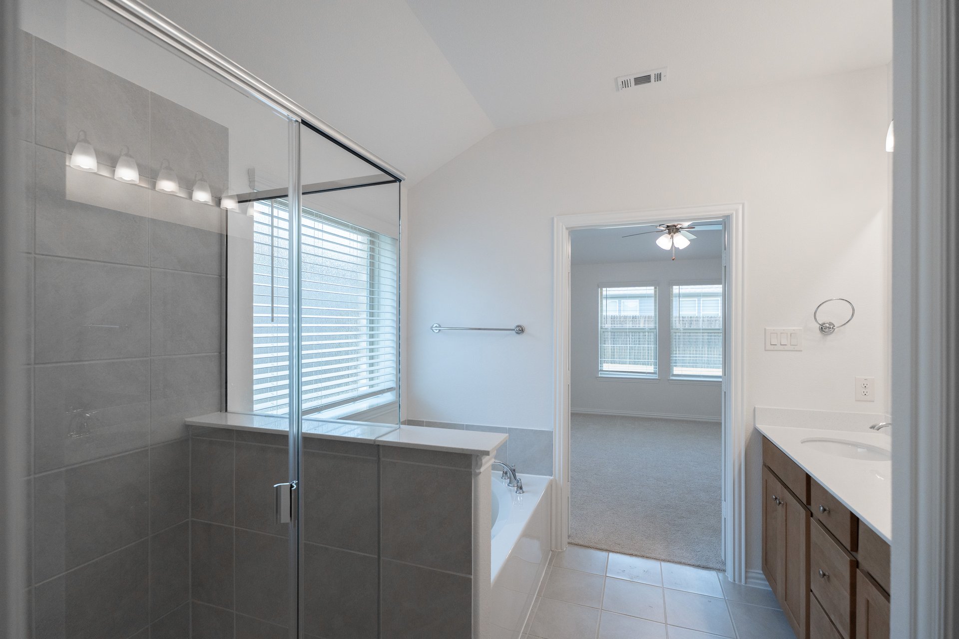 primary bathroom with soaking tub and walk-in shower