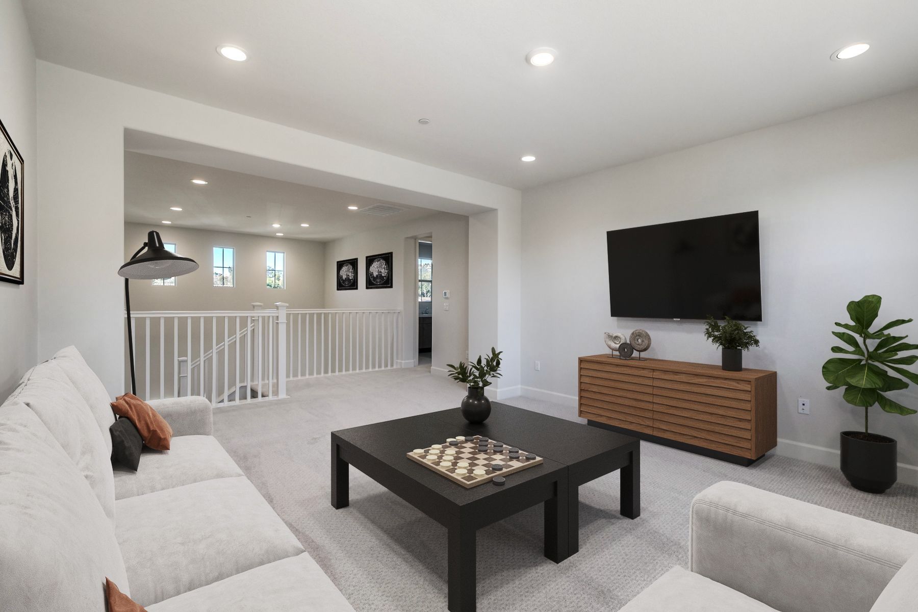 loft with neutral carpet and natural light