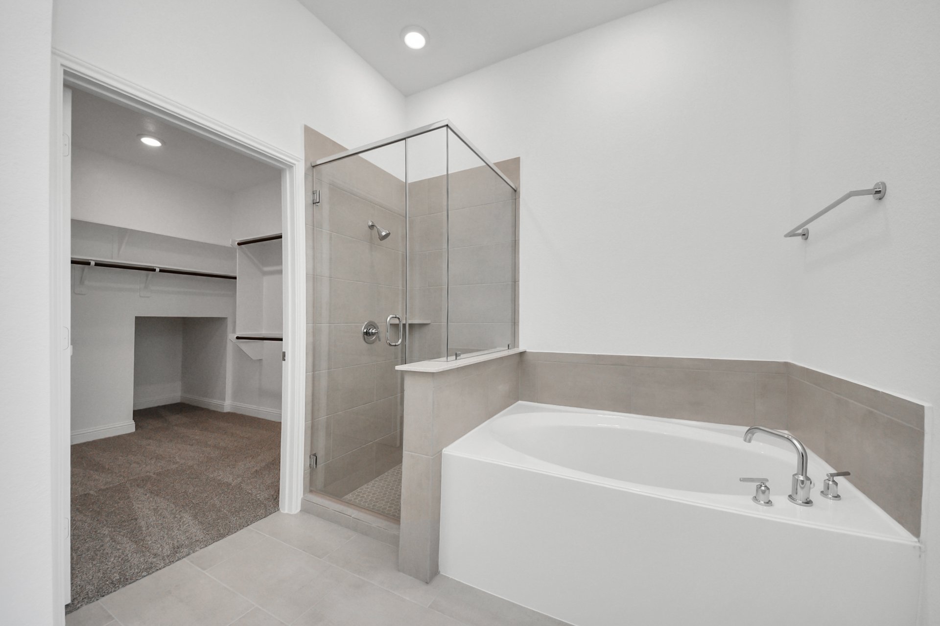 primary bathroom with shower and tub