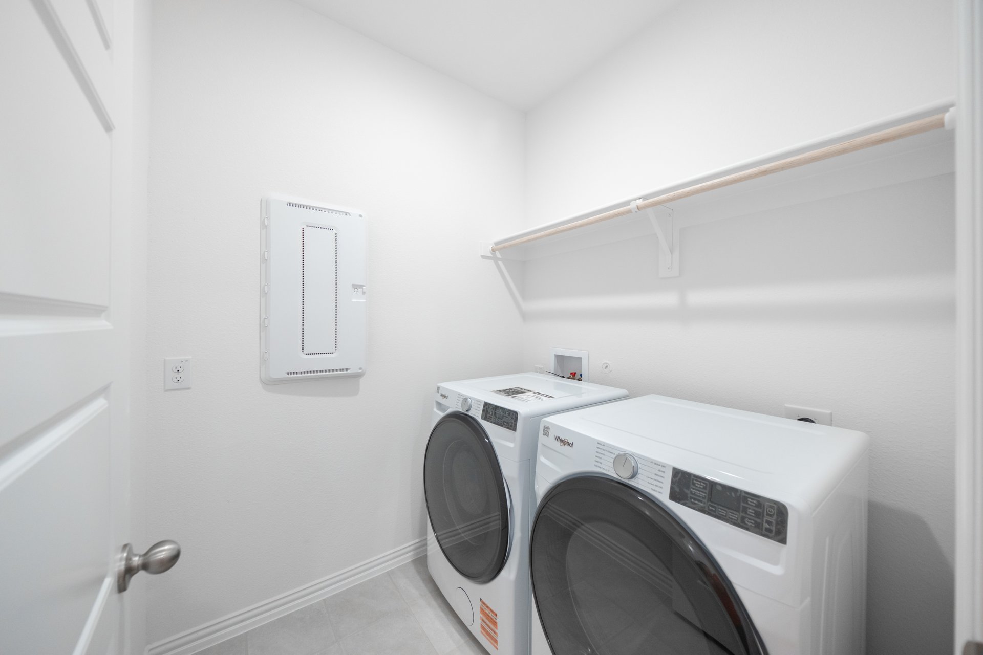laundry room with tile floors, washer, and dryer