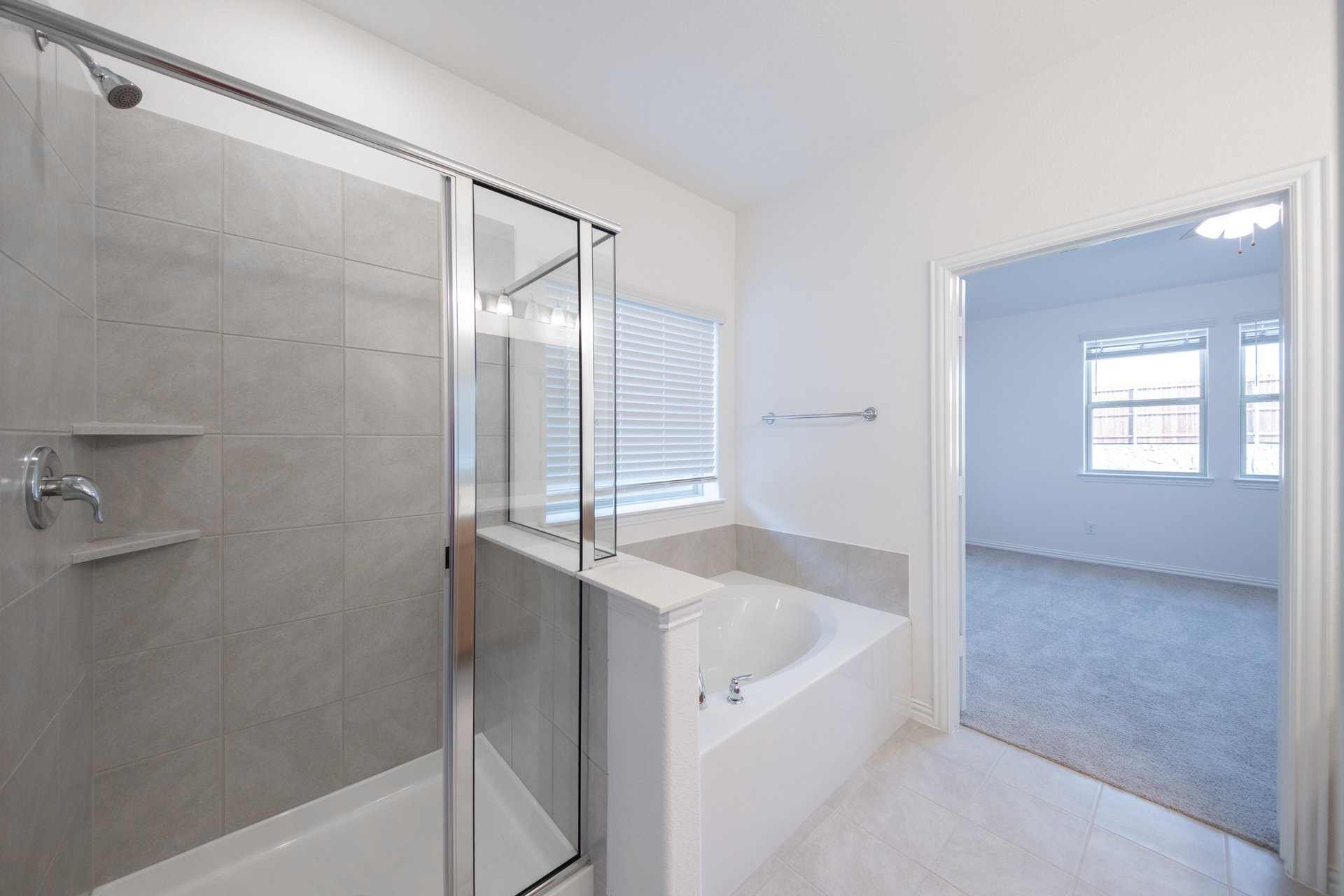 primary bathroom with soaking tub and walk-in shower