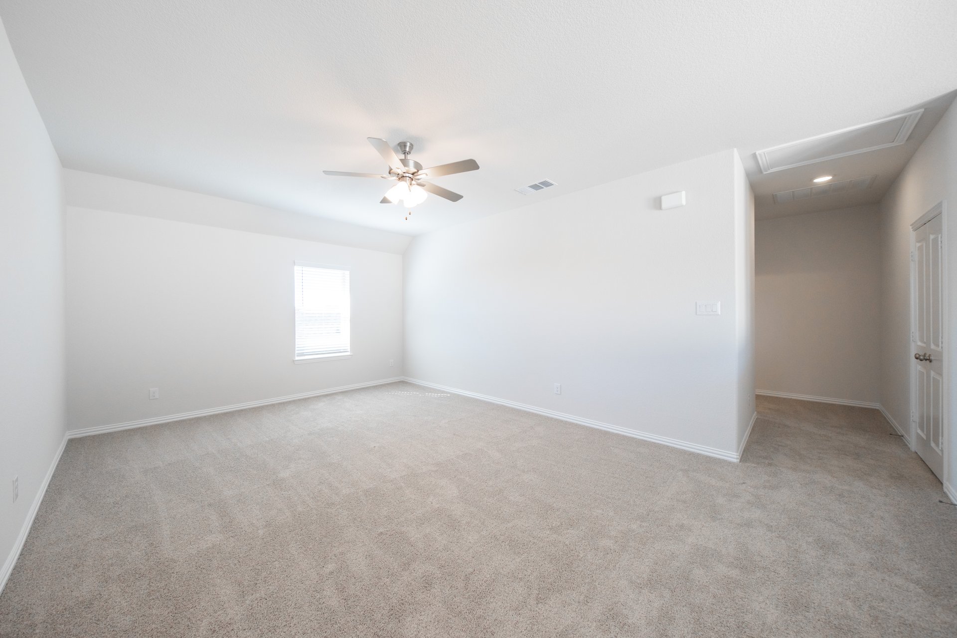 loft with carpet and ceiling fan 