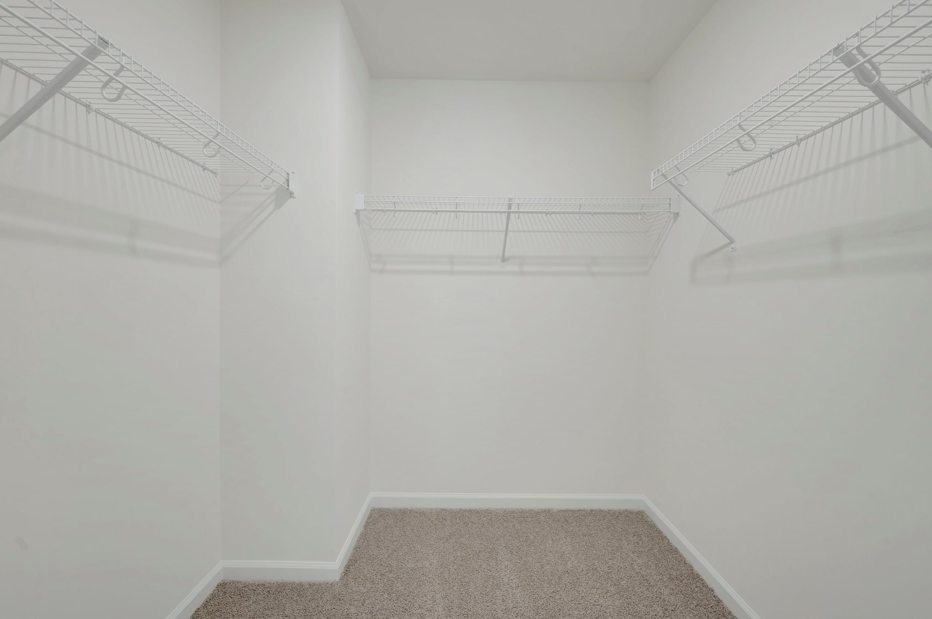 primary walk-in closet with wire shelving