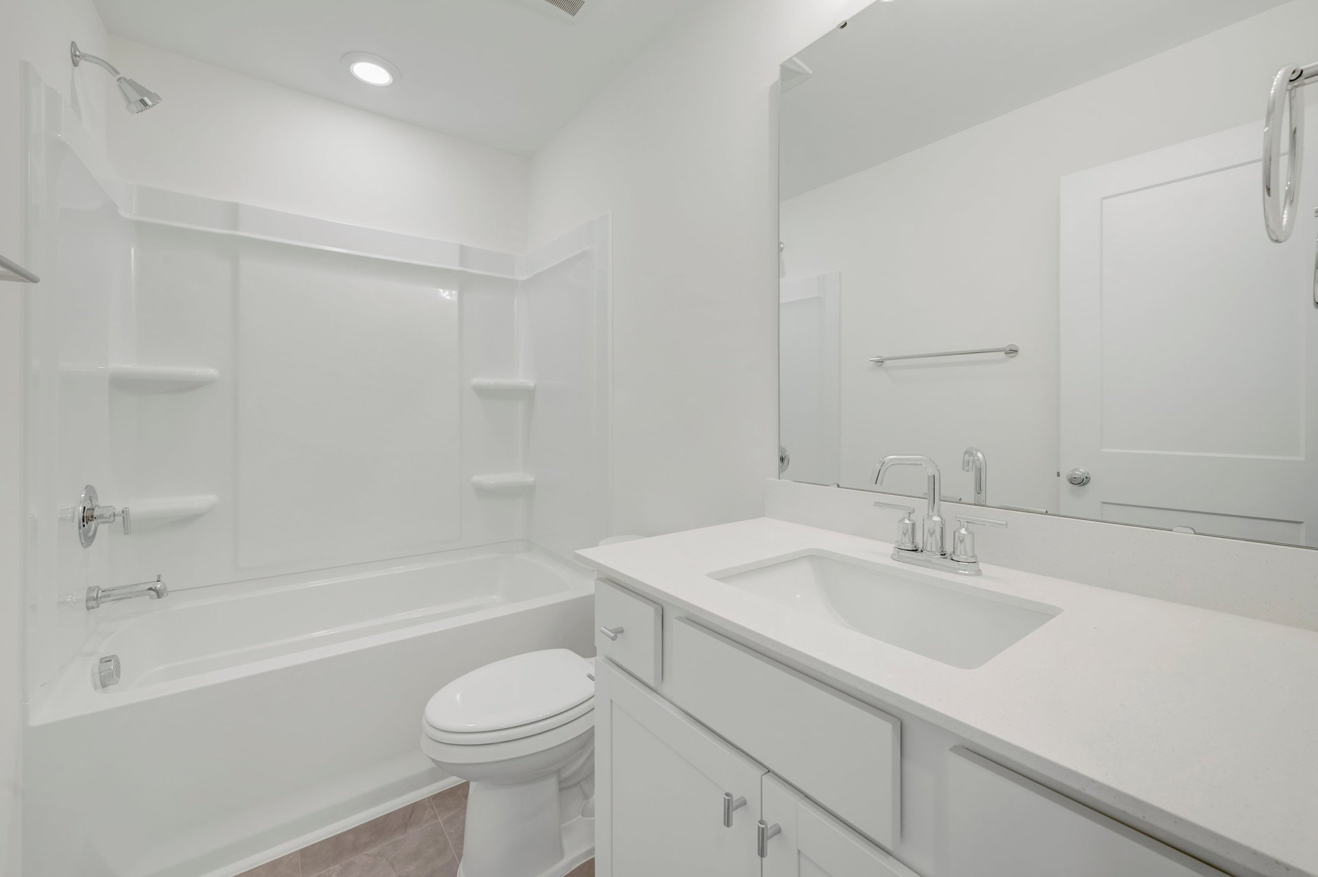 secondary bathroom with a shower and tub combo