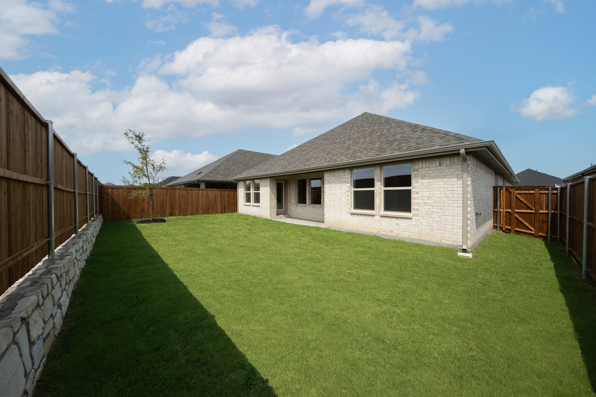 backyard with grass and covered patio