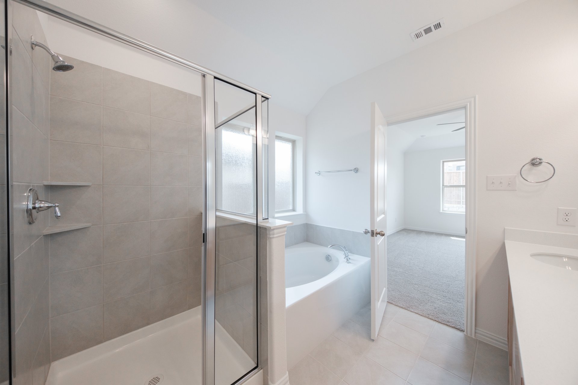 primary bathroom with soaking tub and walk-in shower