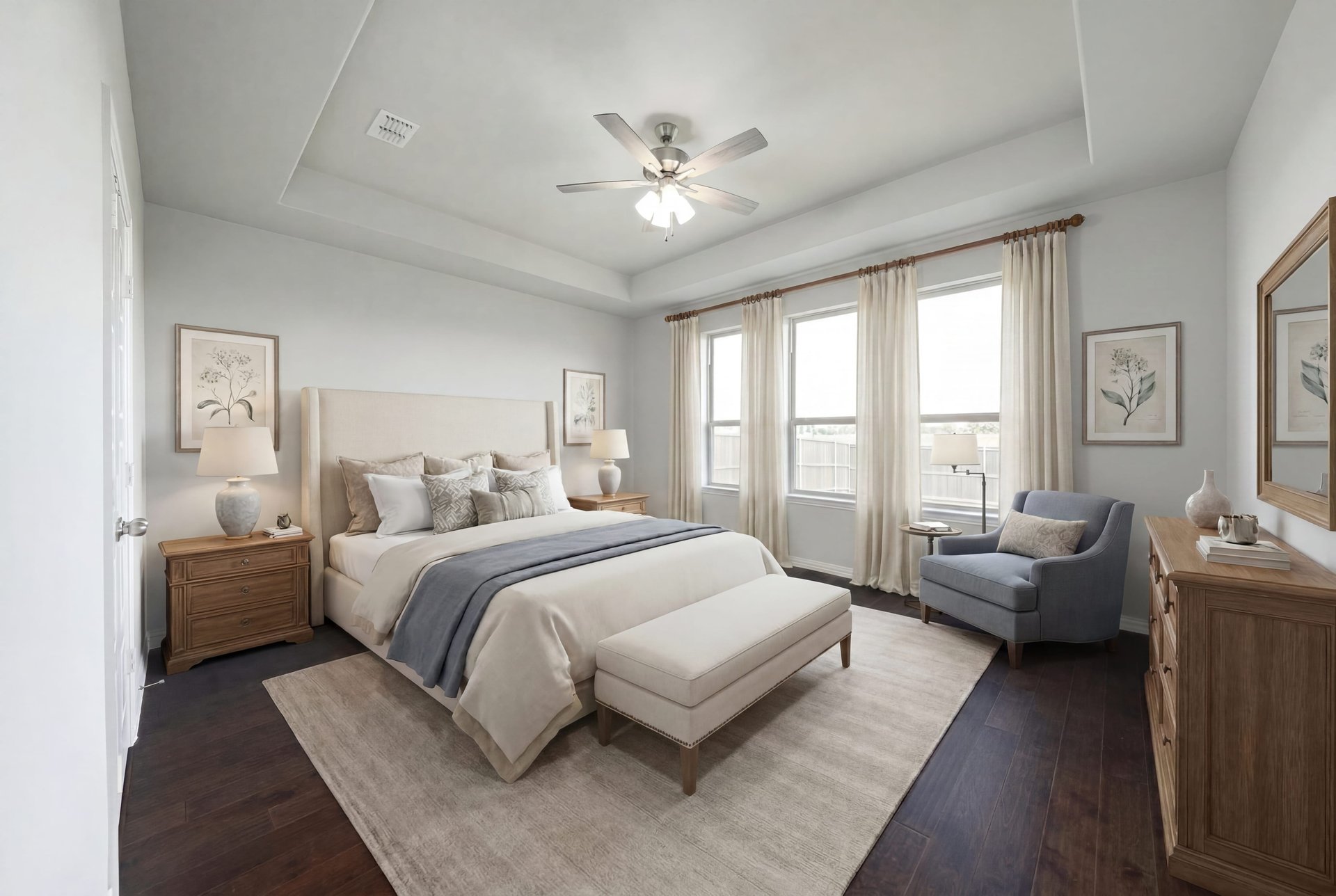 spacious primary bedroom with tray ceiling and carpet