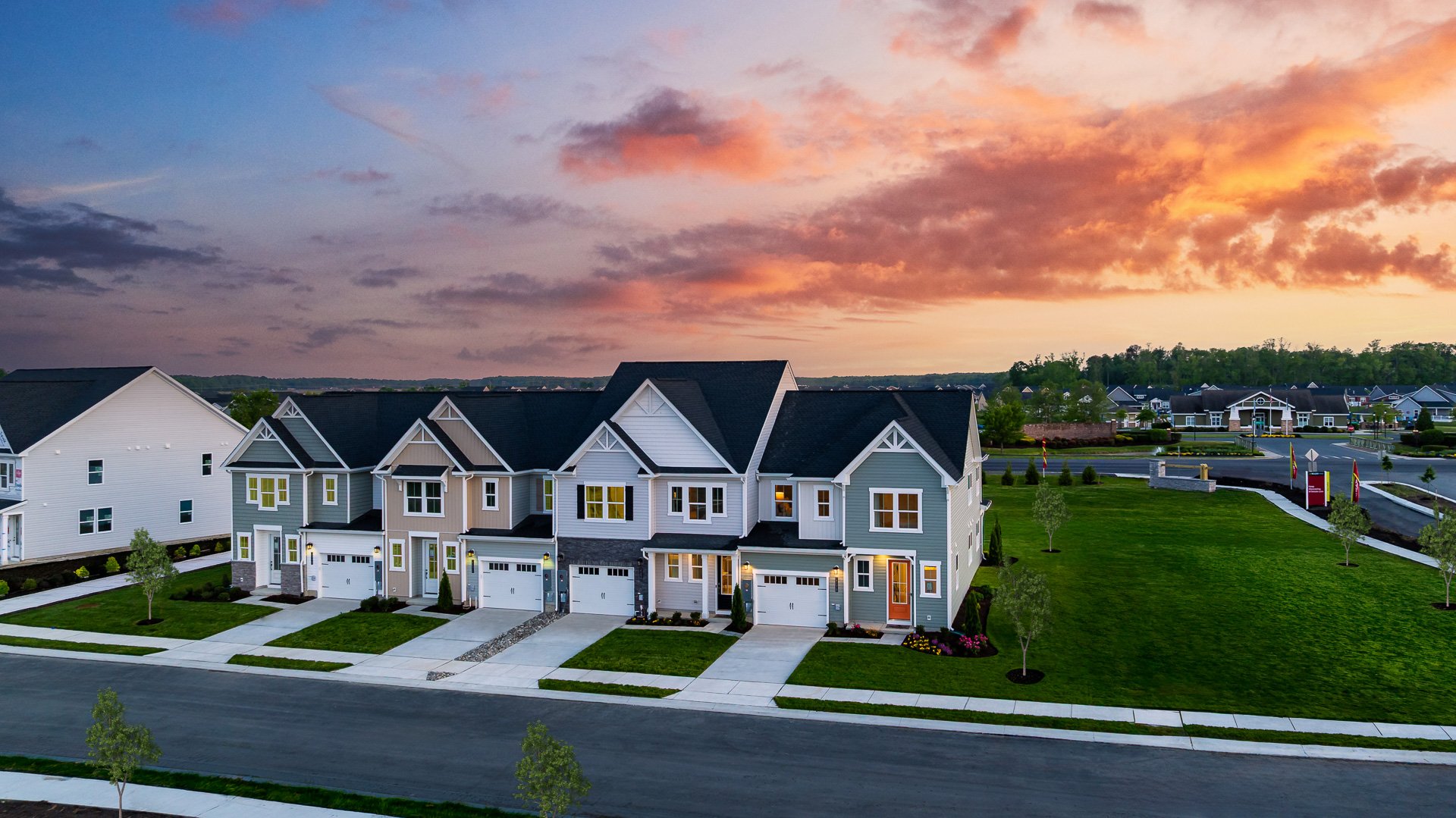 row of villa exteriors at twilight