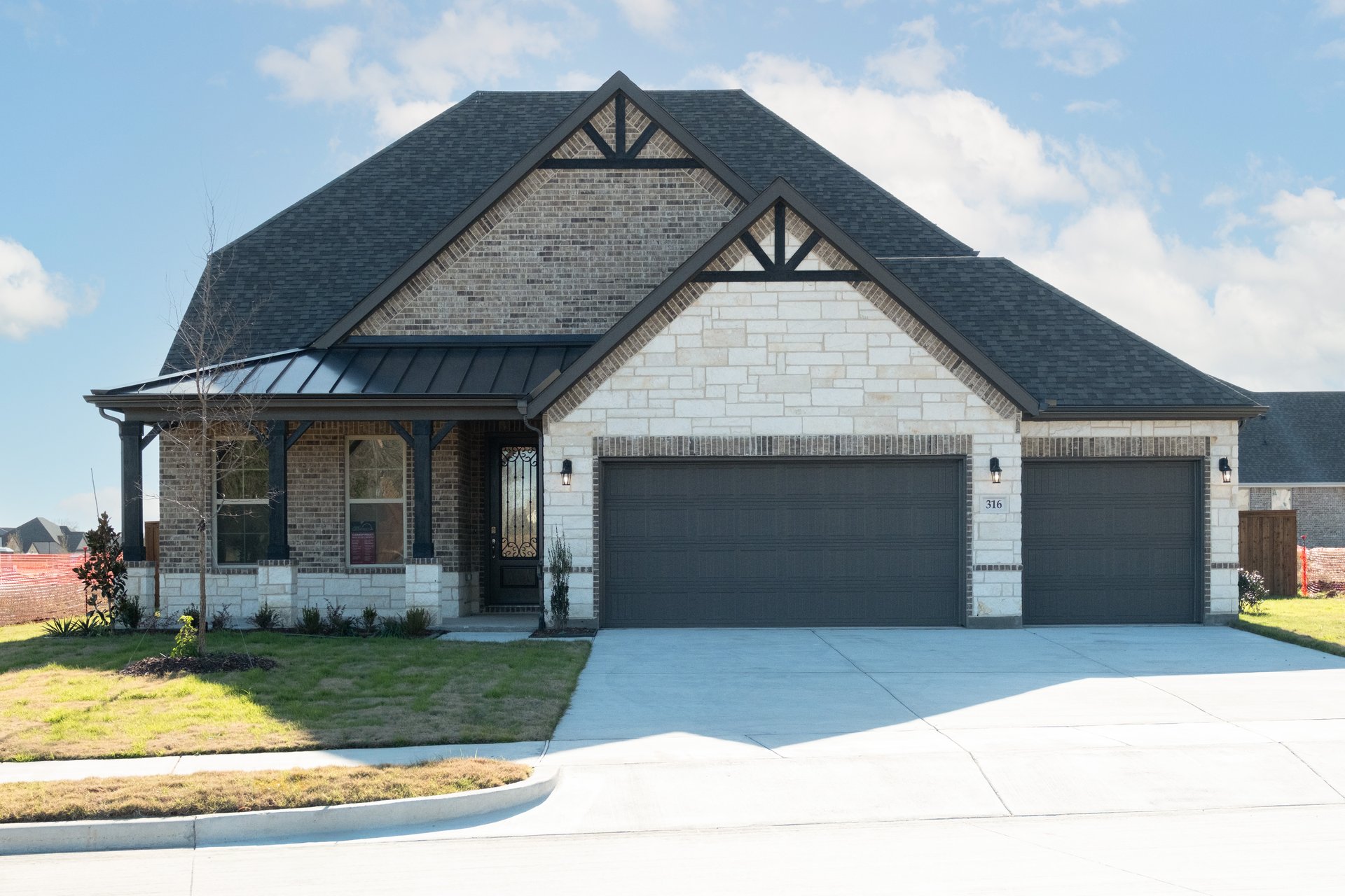 two-story home with brick and stone exterior