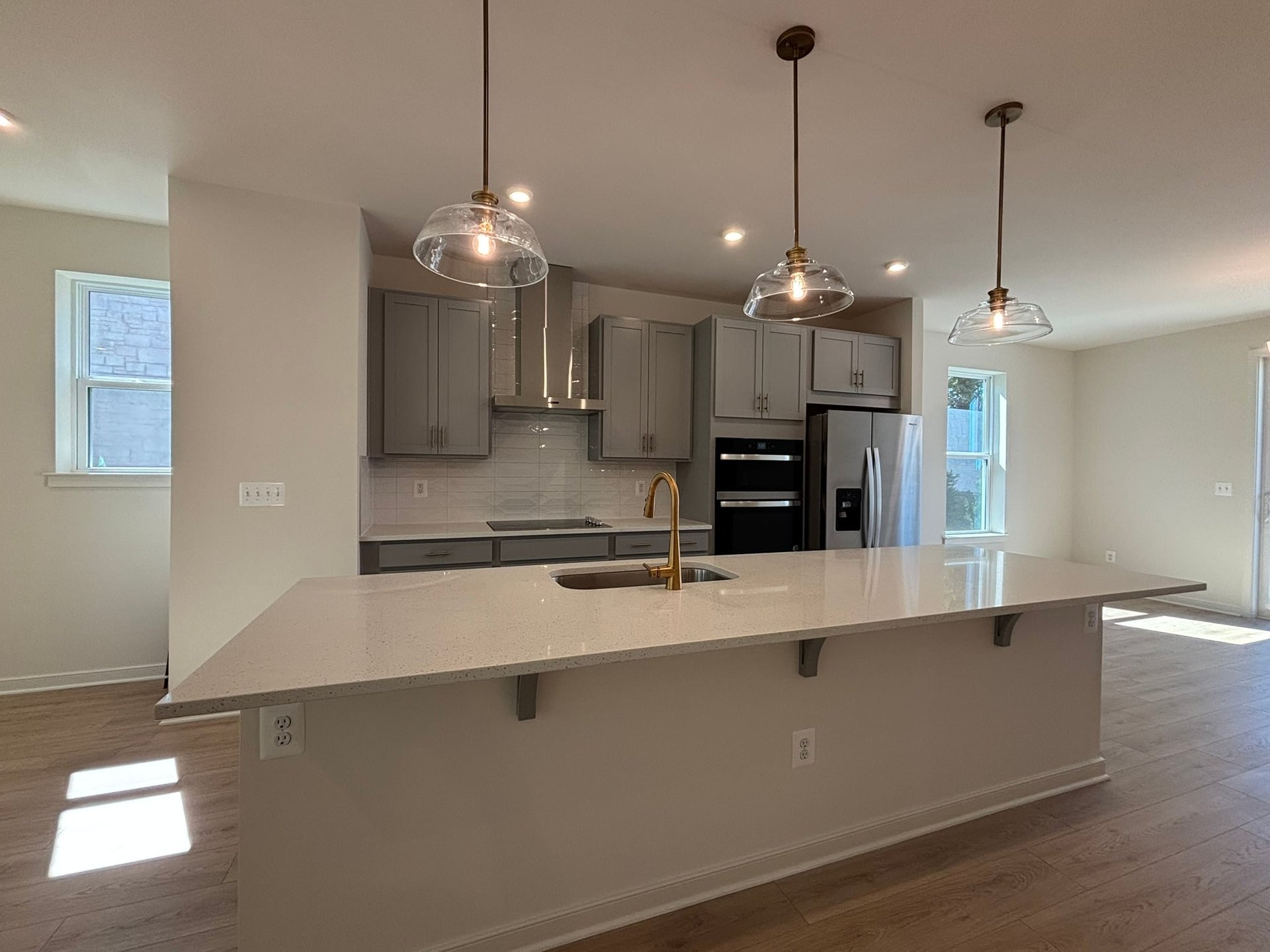 kitchen with gray cabinets and white countertops