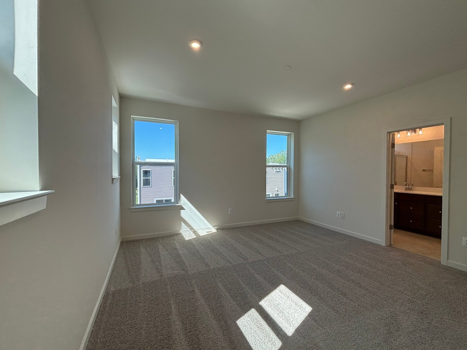 primary bedroom with access to the bathroom