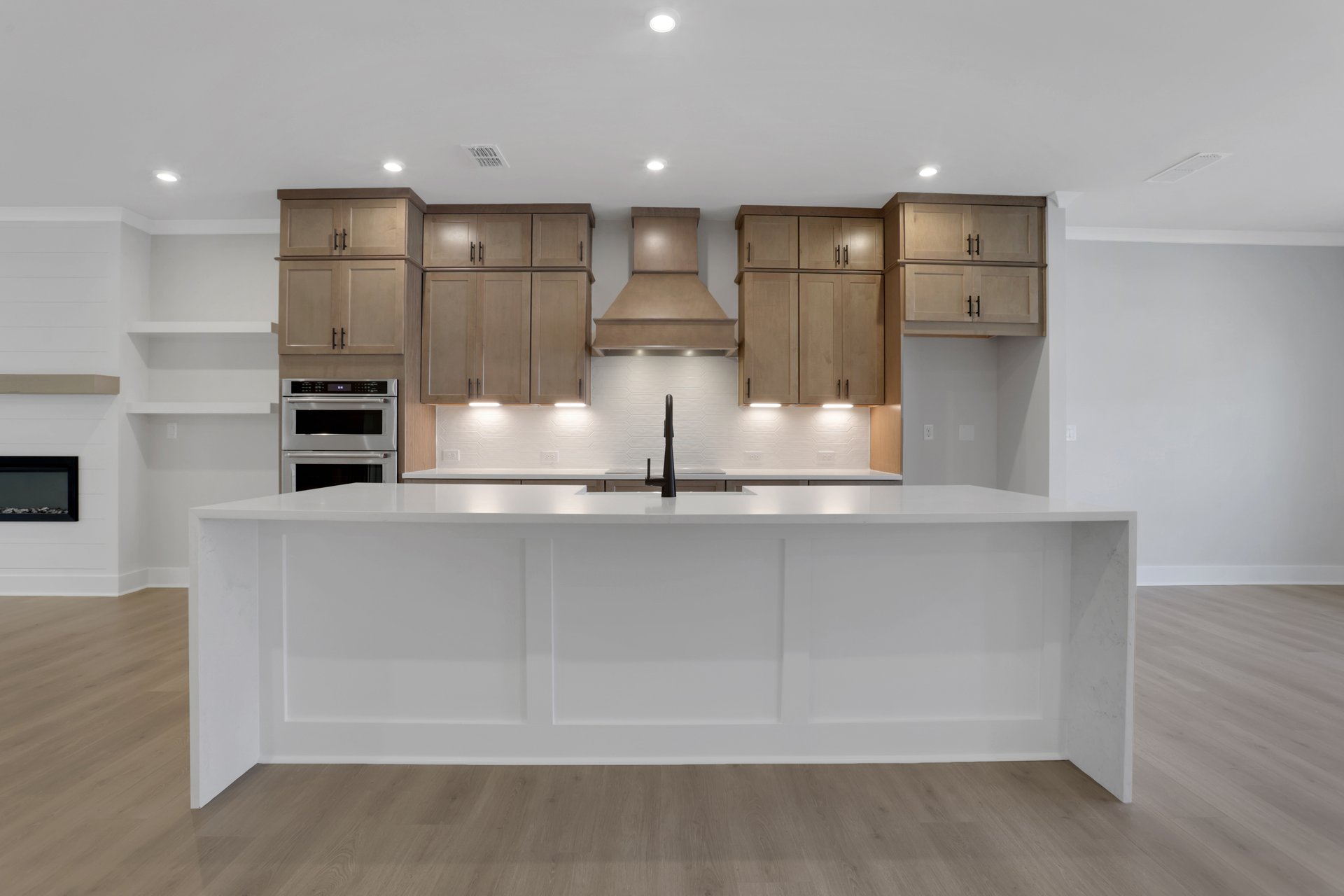 kitchen with wood-finish cabinets and white quartz counters
