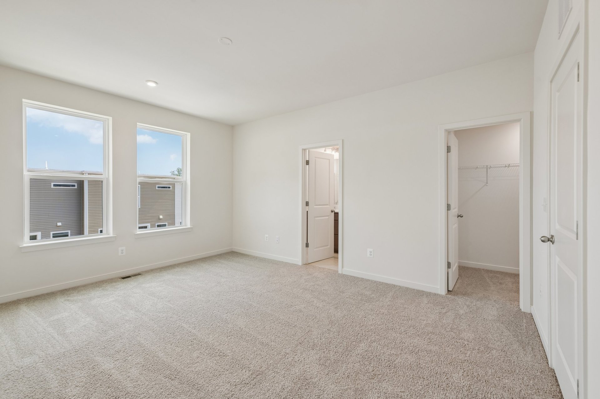 primary bedroom with two windows