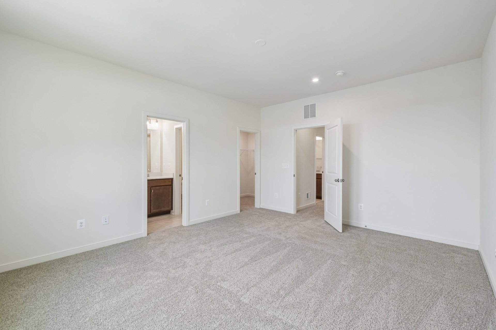 primary bedroom with carpet