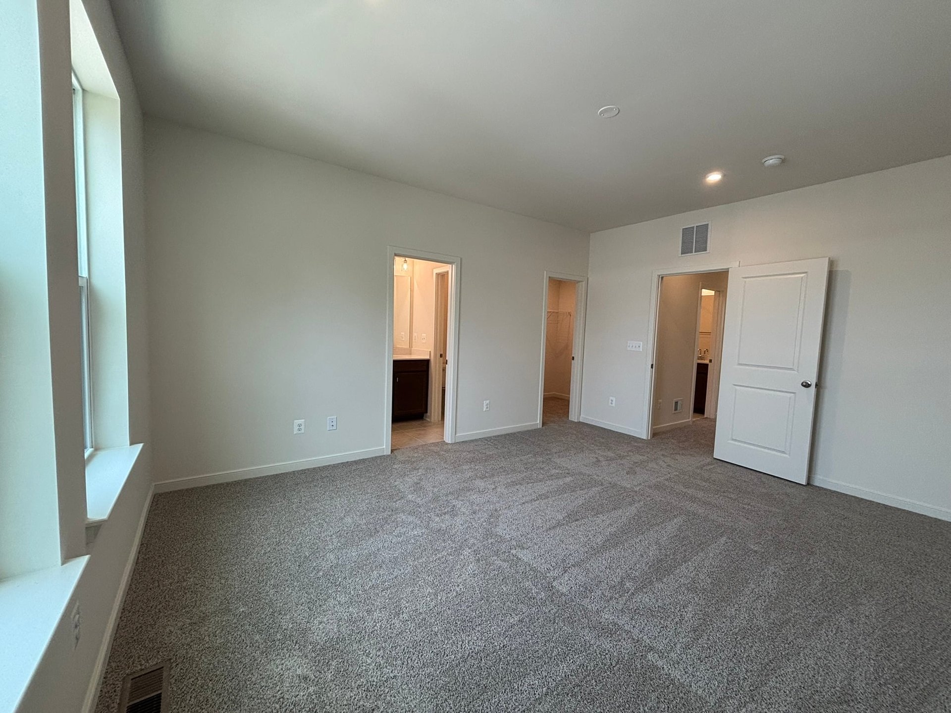 primary bedroom with carpet