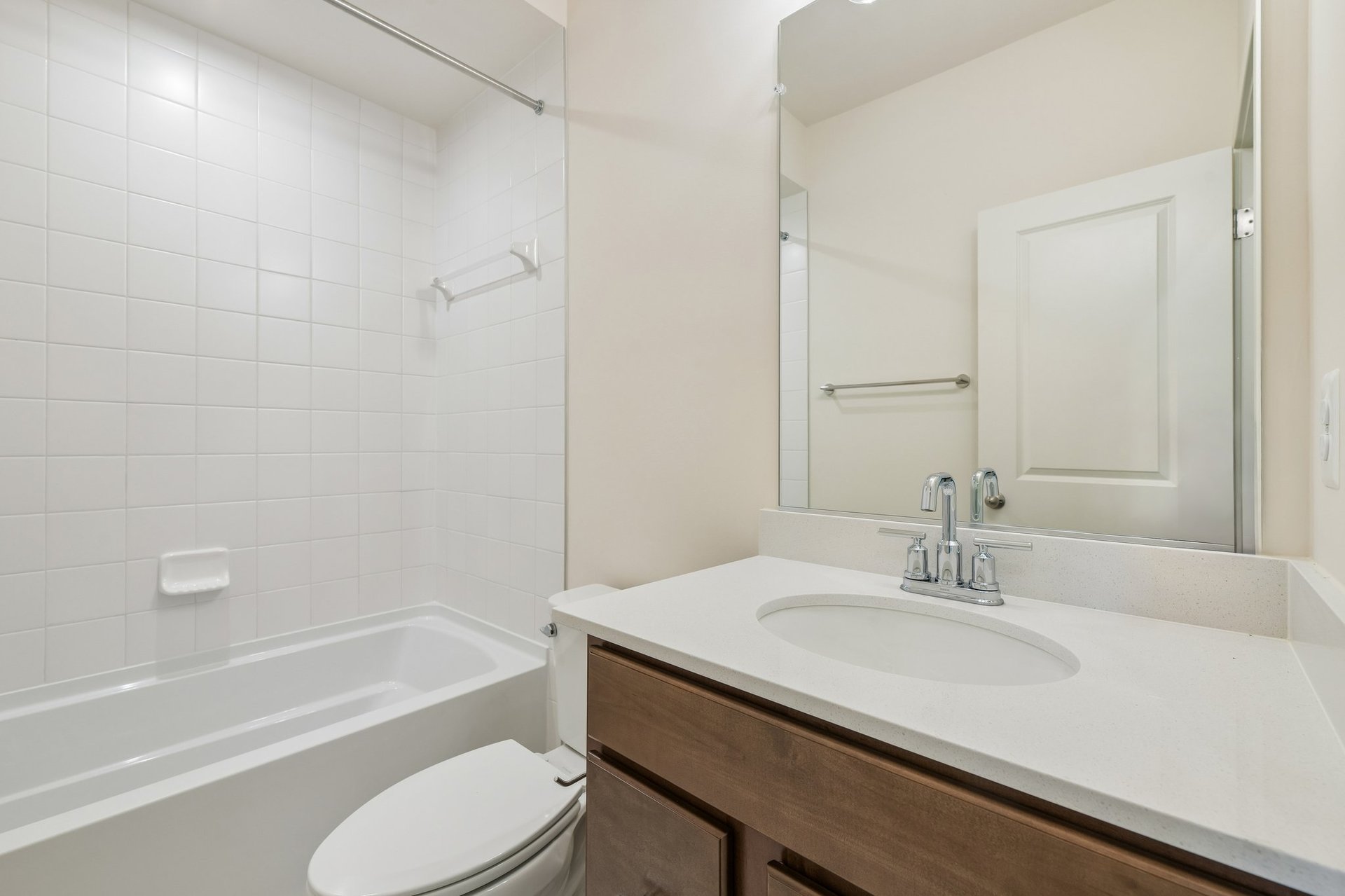 secondary bathroom with a shower and tub combo