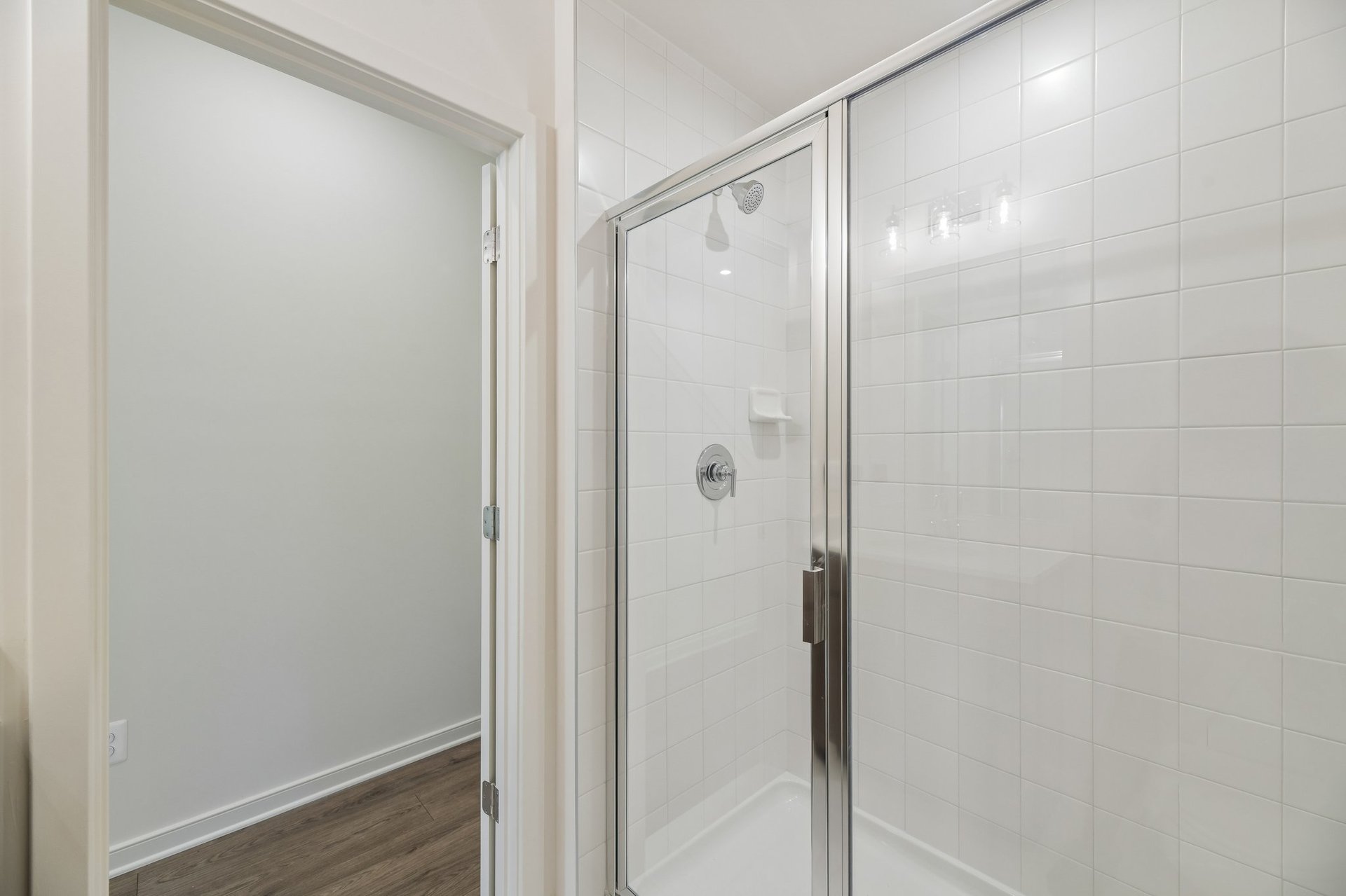 secondary bathroom with a walk-in shower