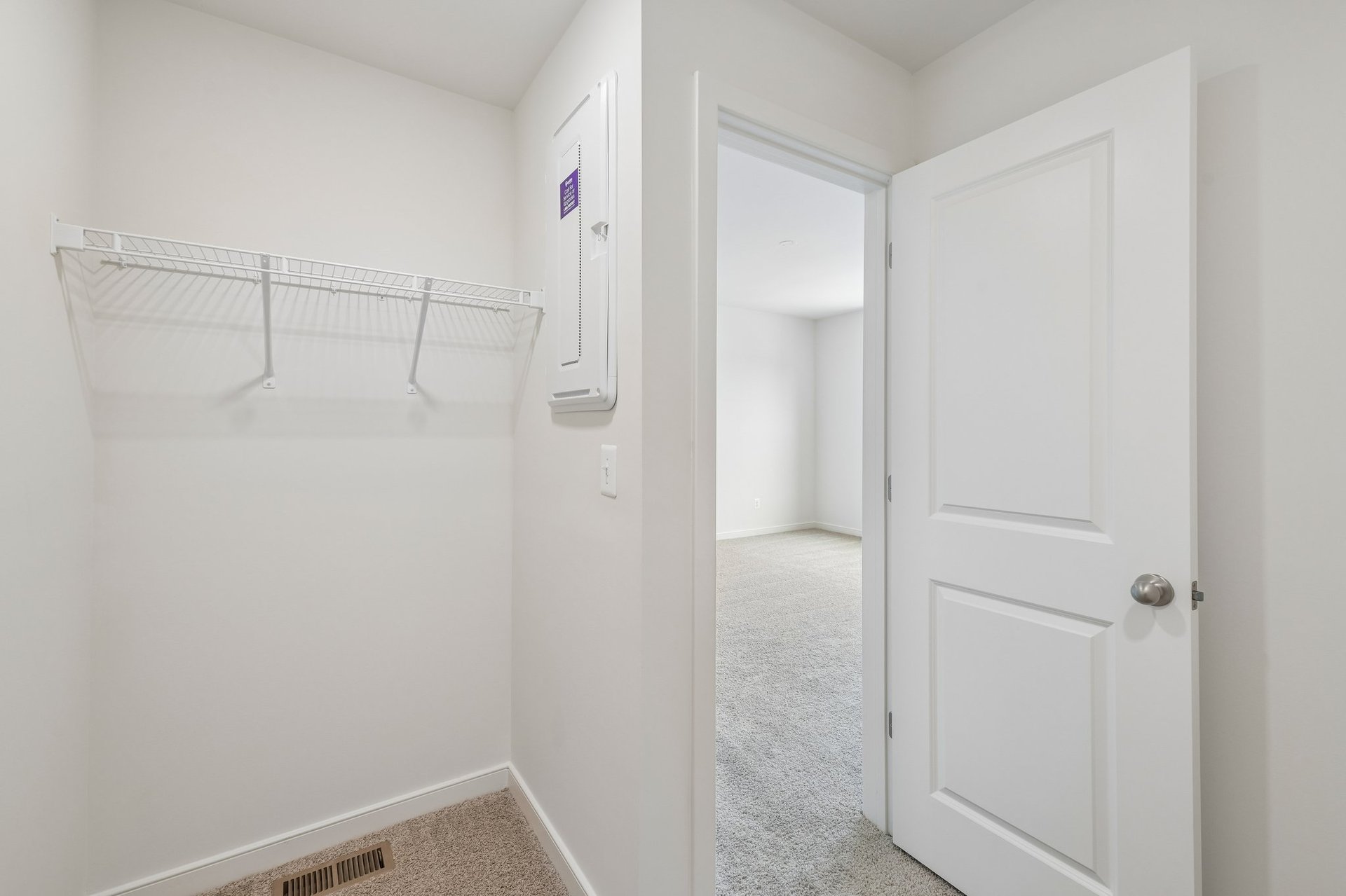primary walk-in closet with wire shelving