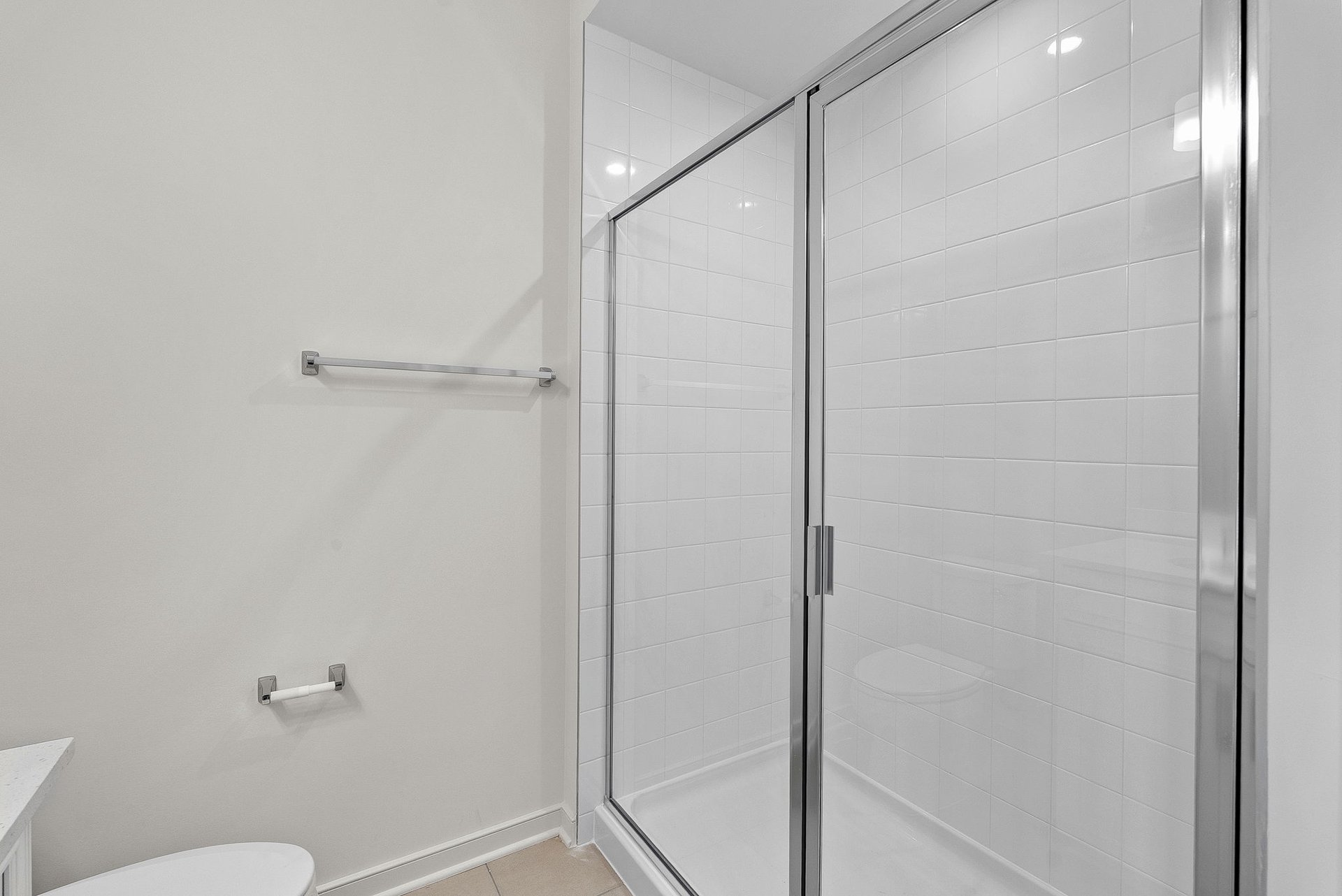 secondary bathroom with an oversized shower
