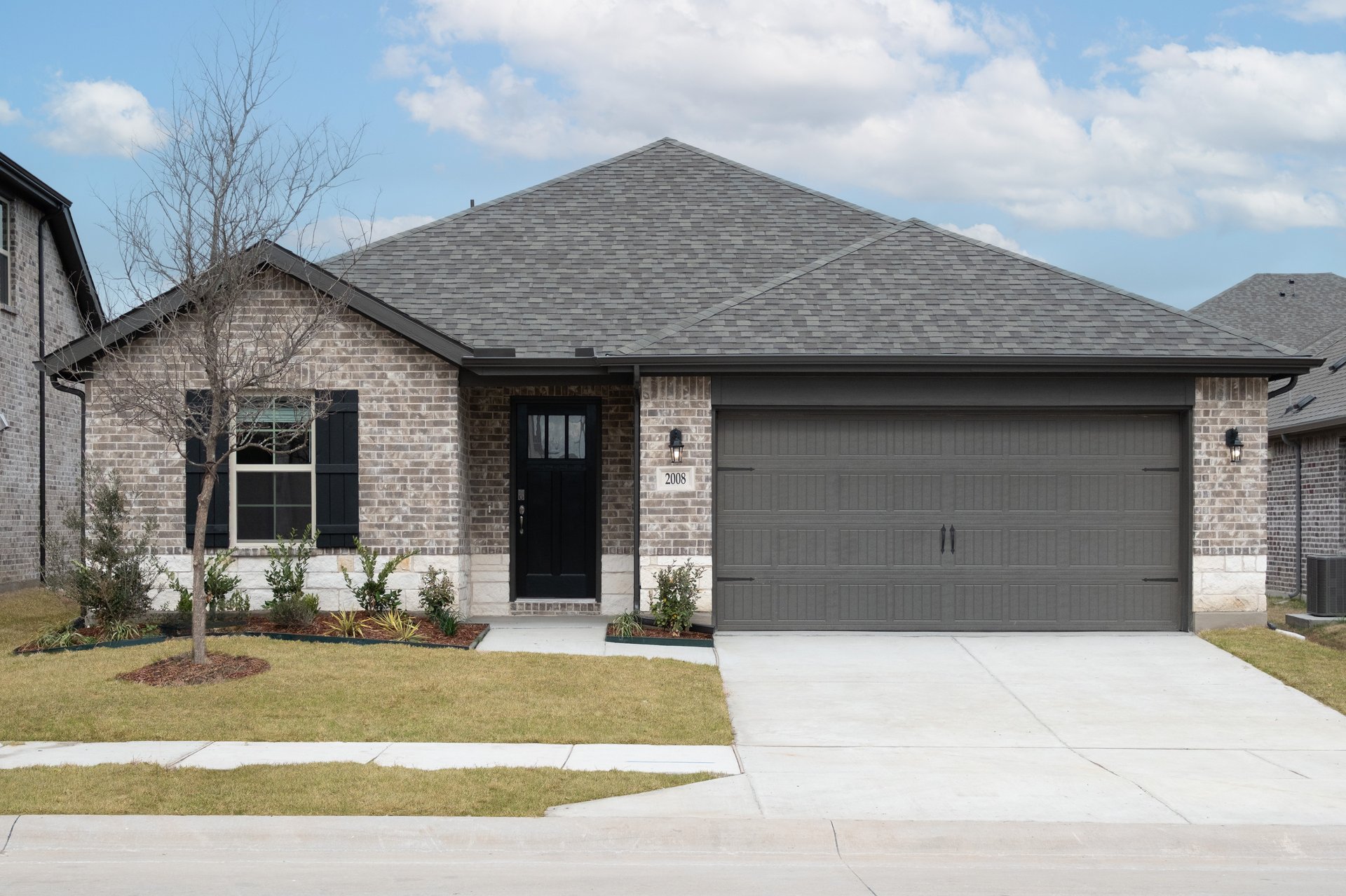 exterior of home with brick and stone