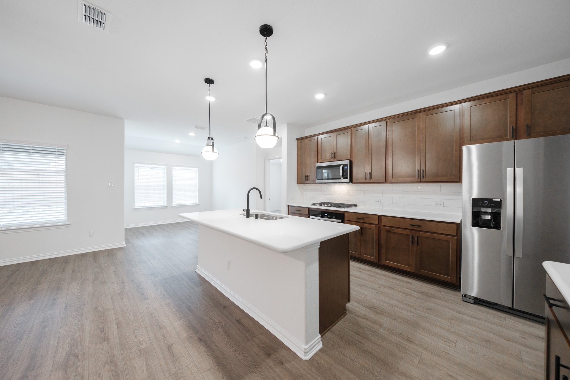 kitchen with open concept and brown cabinets