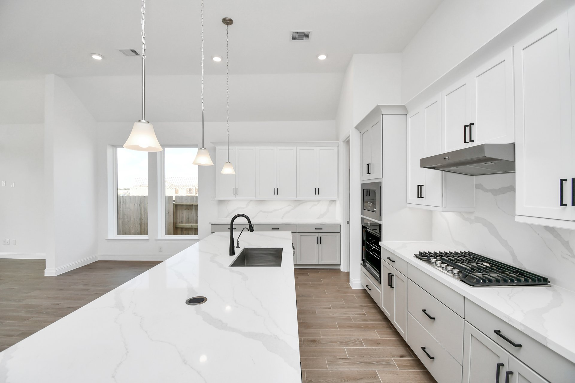 Kitchen with white counter tops. 