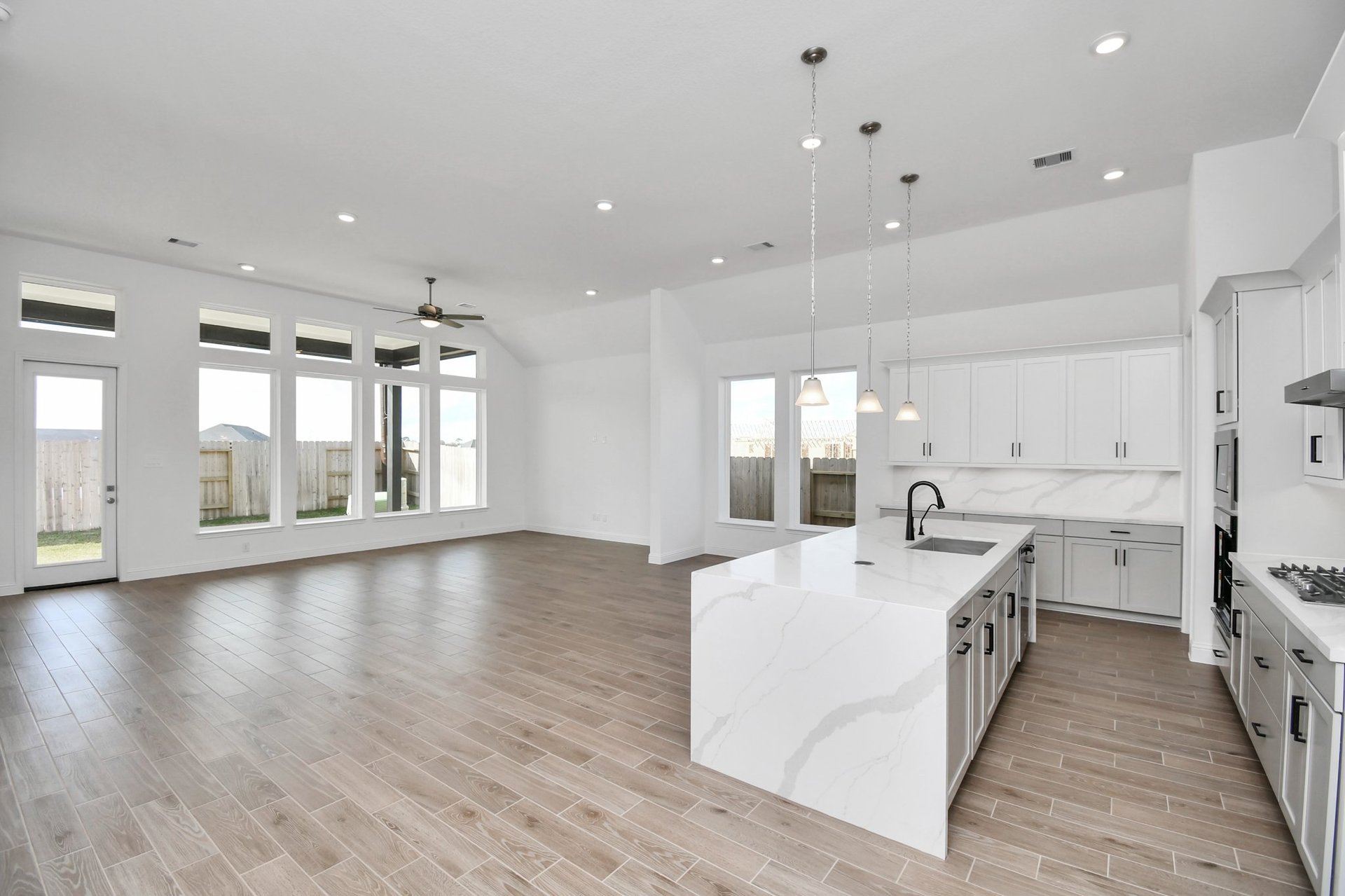 kitchen with white cabinet and white counter tops.