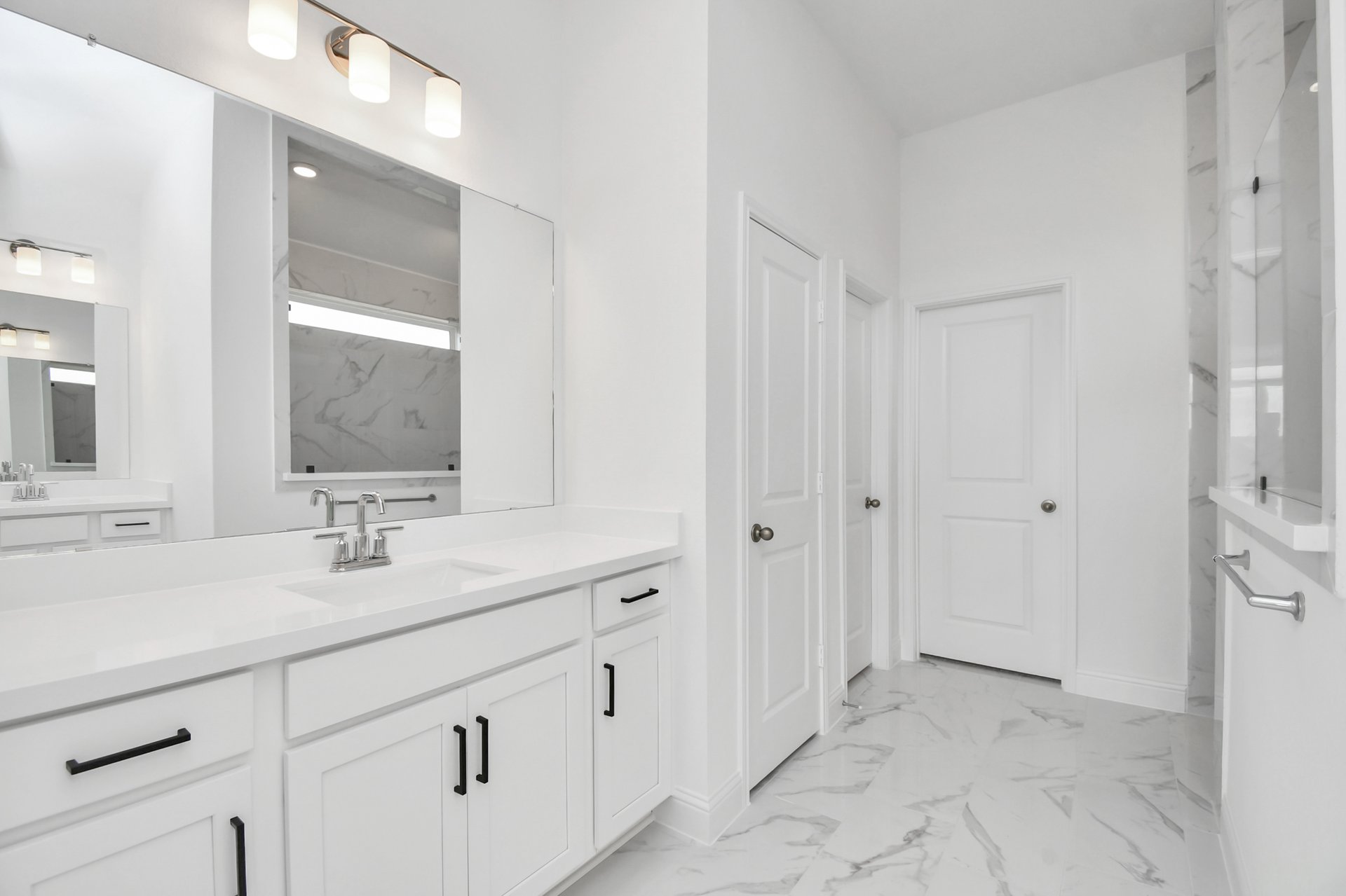 Primary bathroom with two sinks.