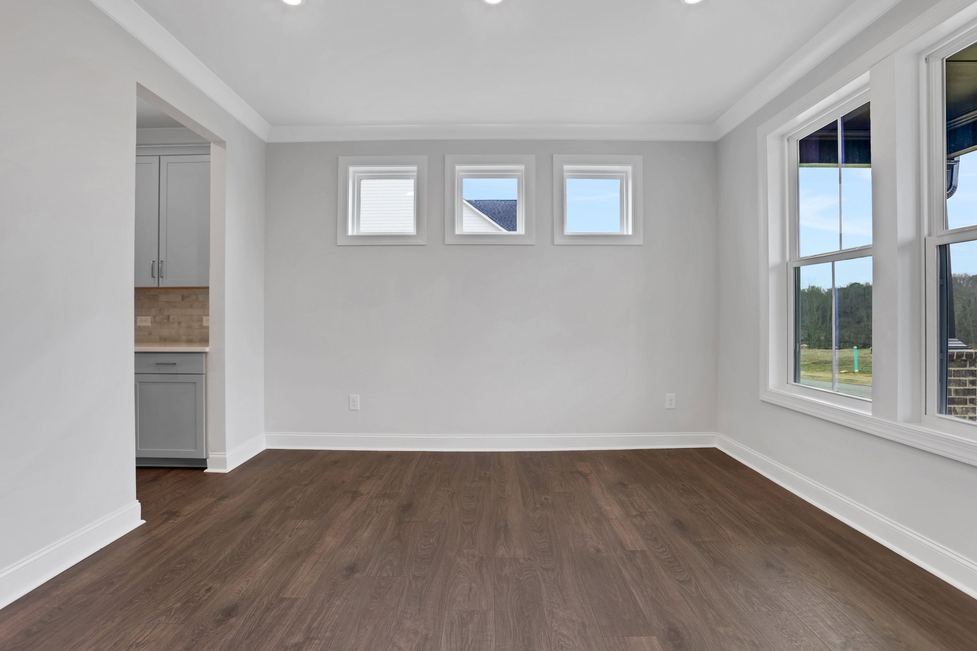 dining room with hard surface flooring and butler's pantry