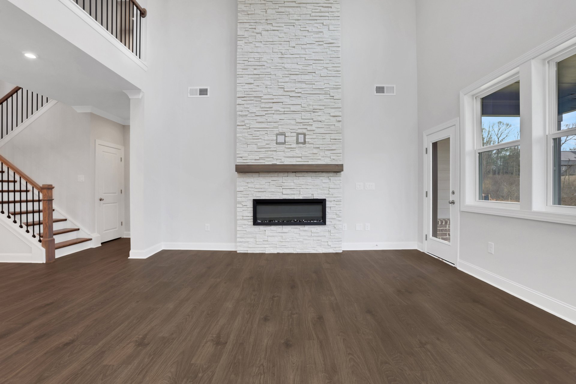 great room with 2-story ceilings and fireplace