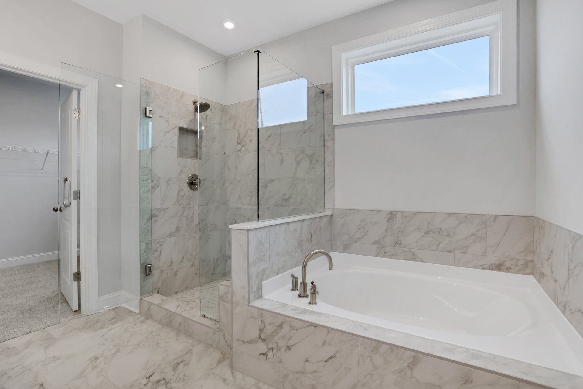 primary bathroom with separate shower and tub
