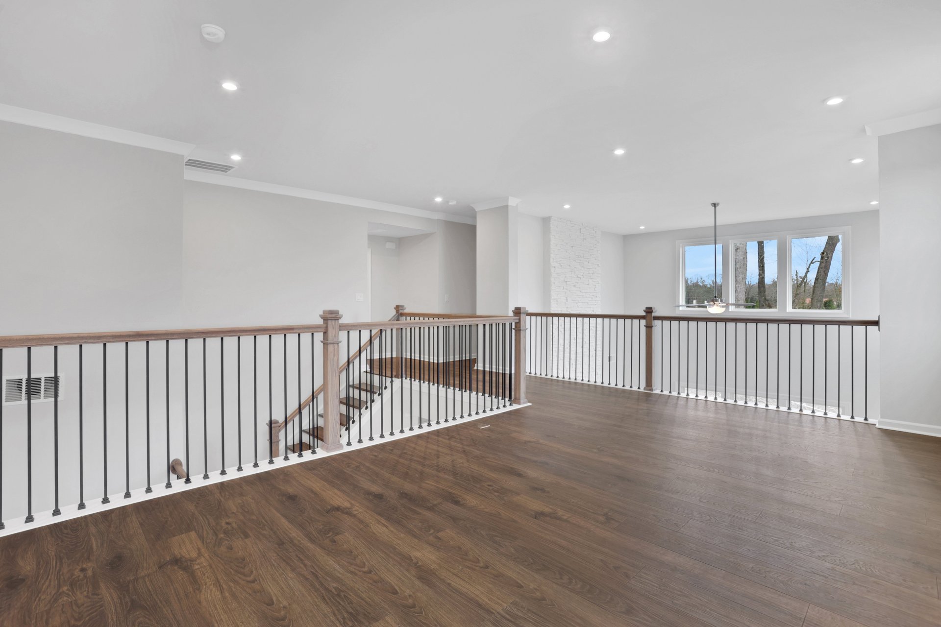 loft with hard surface flooring overlooking great room