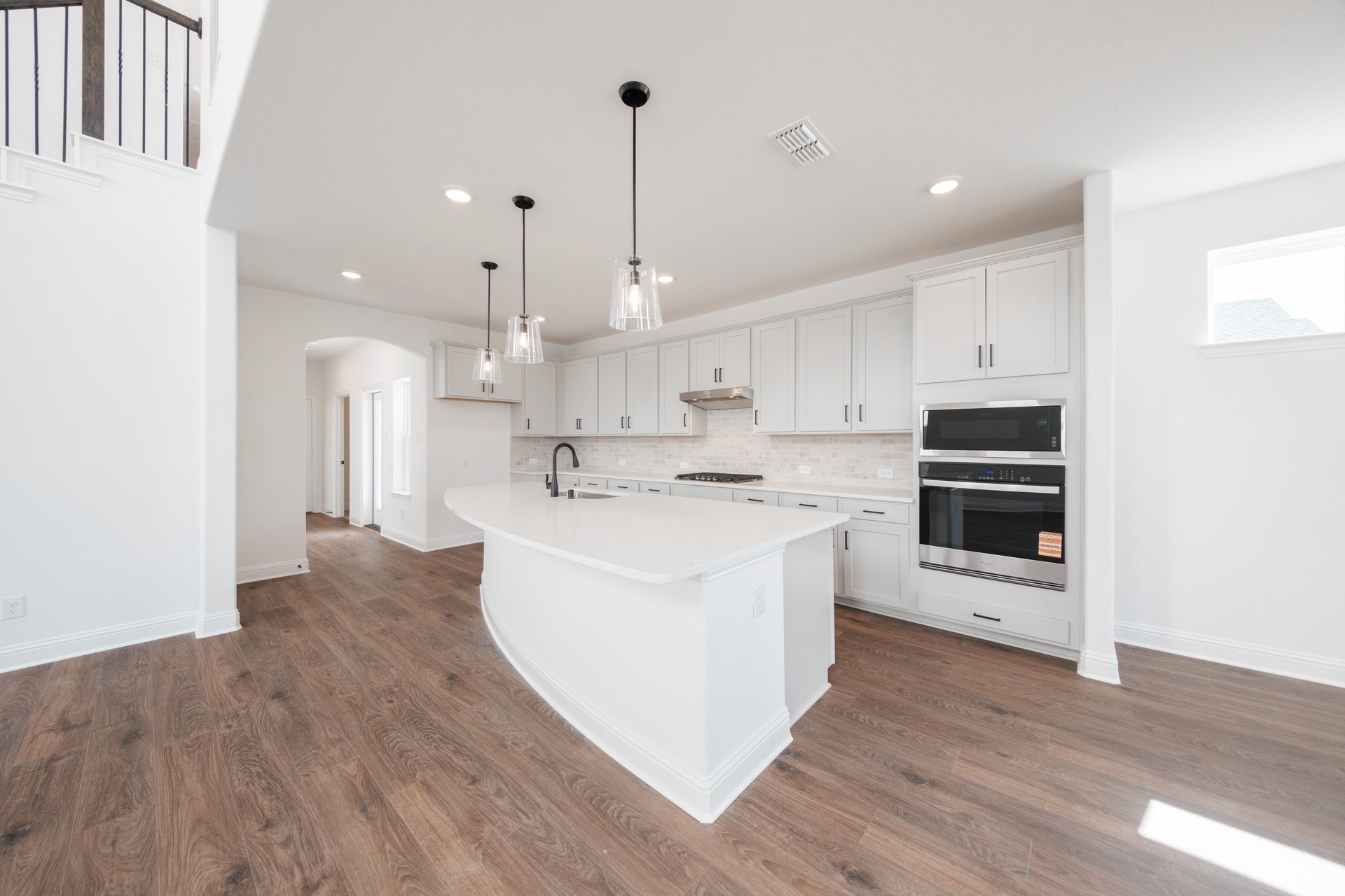 kitchen with large island and white cabinets