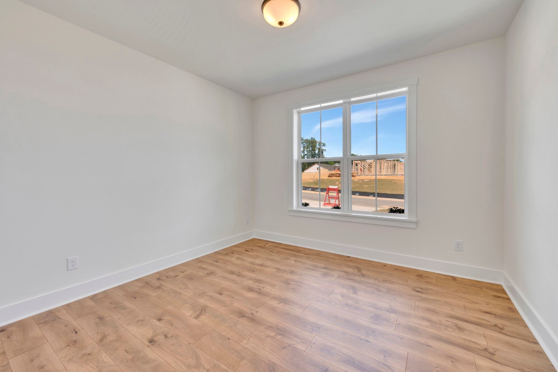 first floor bedroom with two windows