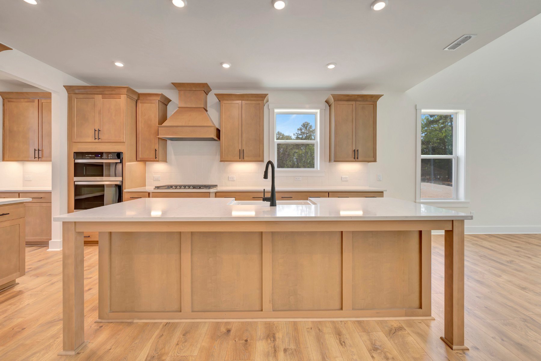 kitchen with an island with a sink