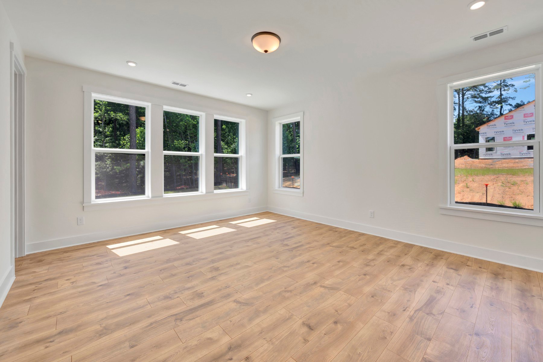 primary bedroom with five windows
