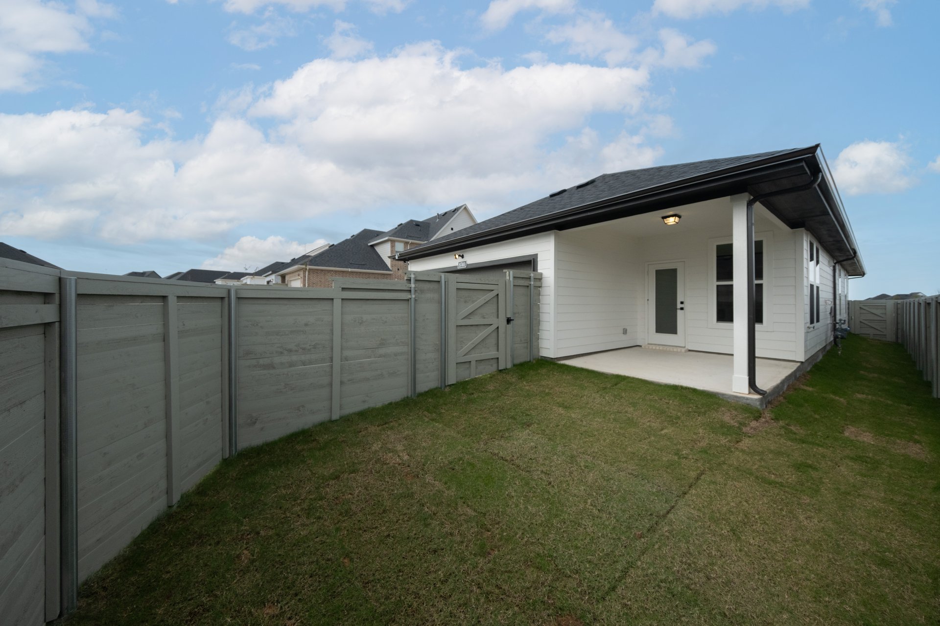 yard with grass and covered patio 